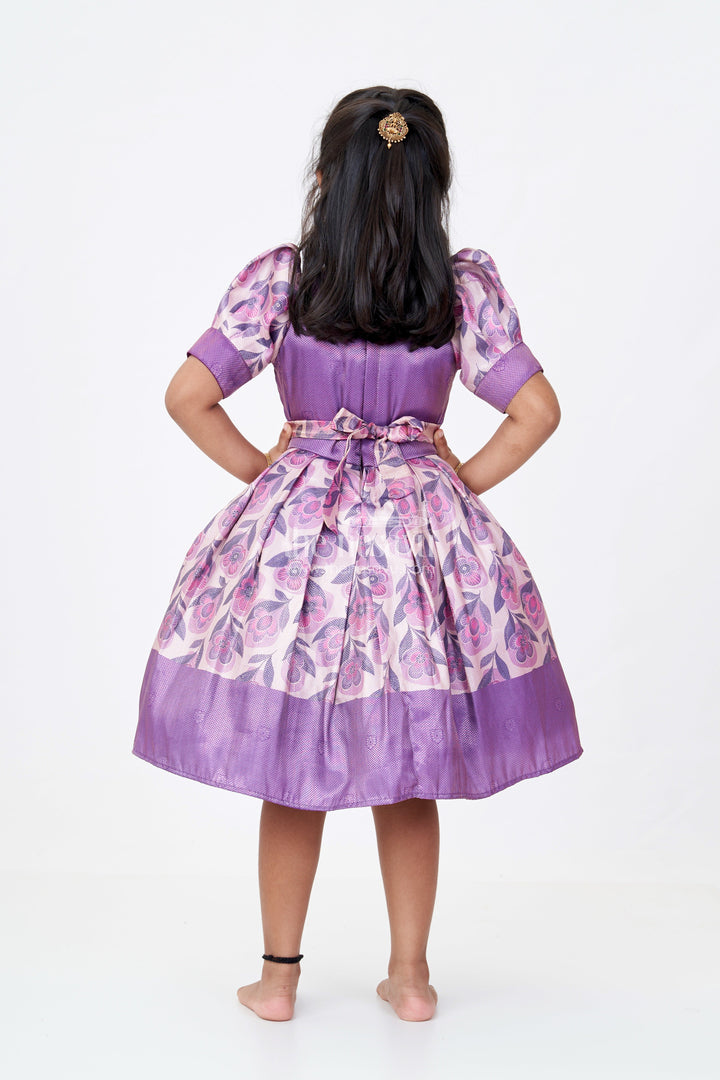 The Nesavu Silk Frock Girls Cotton Silk Frock in Rich Purple Jacquard with Floral Border and Embellished Neckline Nesavu Nesavu Girls Cotton Silk Frock Purple Jacquard Floral Print Border Embellished Neckline