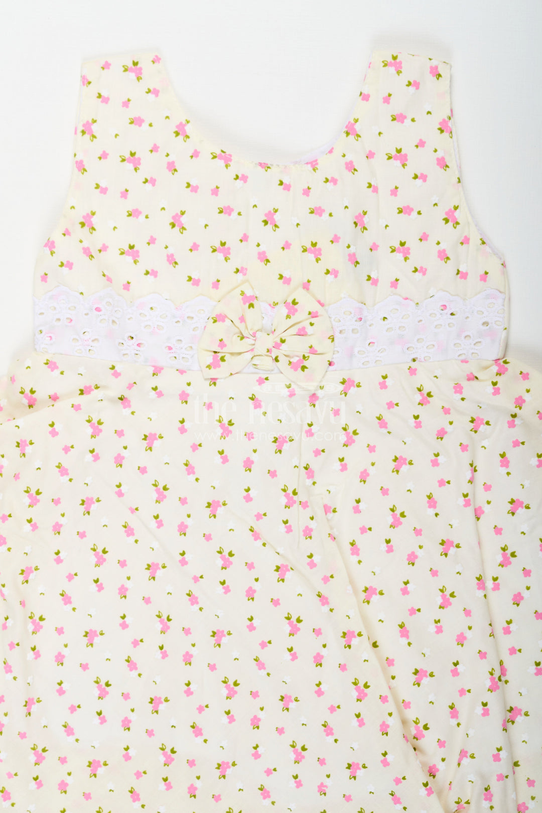 The Nesavu Baby Cotton Frocks Girls Cream Soft Cotton Dresses Online with Allover Floral Print and Lace Bow Waist Detail Nesavu Nesavu Soft Cotton Dresses Online Girls Allover Floral Print Lace Waist Bow Detail
