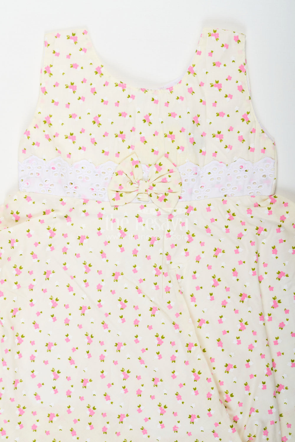 The Nesavu Baby Cotton Frocks Girls Cream Soft Cotton Dresses Online with Allover Floral Print and Lace Bow Waist Detail Nesavu Nesavu Soft Cotton Dresses Online Girls Allover Floral Print Lace Waist Bow Detail