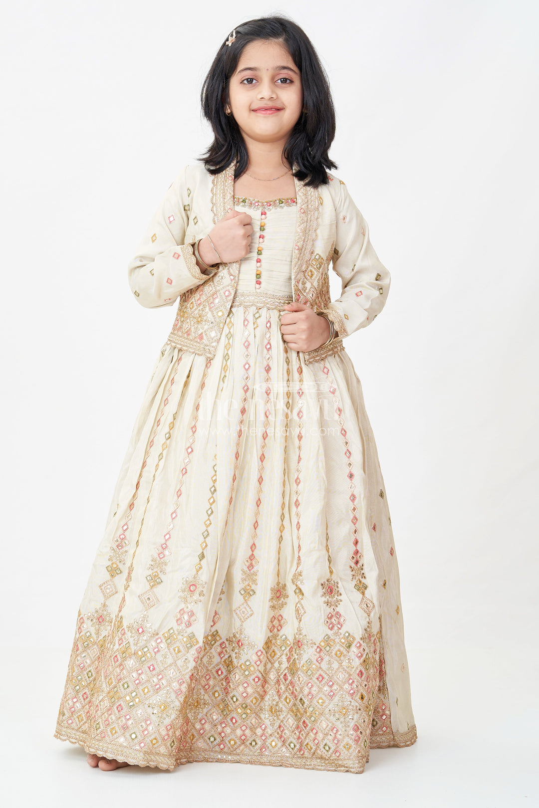 The Nesavu Girls Silk Gown Girls Designer Anarkali in Ivory Shimmer Silk with Embroidered Jacket and Pleated Skirt Finish Nesavu Ivory Designer Anarkali Gown Girls Shimmer Silk Embroidered Jacket Flared Skirt | The Nesavu