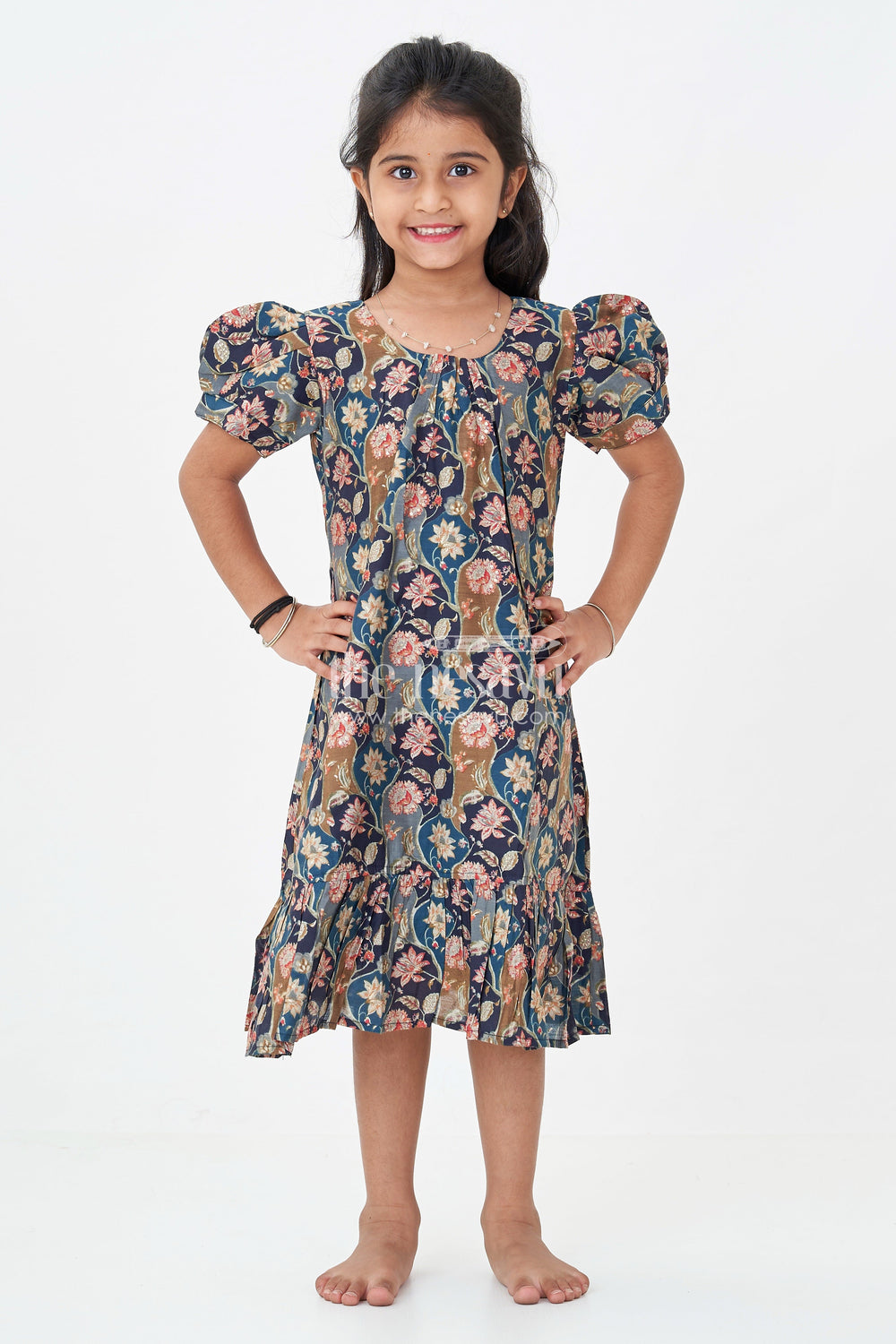 The Nesavu Girls Fancy Frock Girls Floral Frock Pattern Top in Blue Modal Silk with Ruffle Hem and Puff Sleeves for All-Day Style Nesavu Nesavu Girls Blue Floral Modal Silk Frock Pattern Top Puff Sleeves Ruffle Hemline