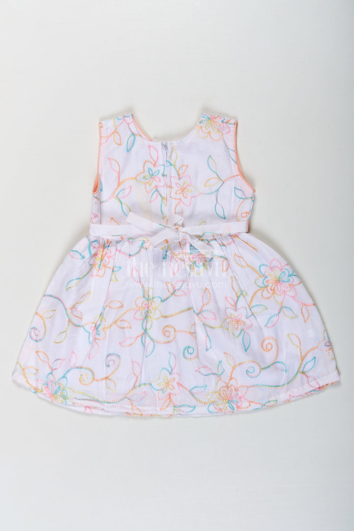 The Nesavu Baby Cotton Frocks Girls Flower White Dress in Cotton with Multicolor Floral Embroidery and Peach Waist Bow Nesavu Nesavu Flower White Dress Girls Embroidered Cotton Multicolor Floral Patterns Bow Accent