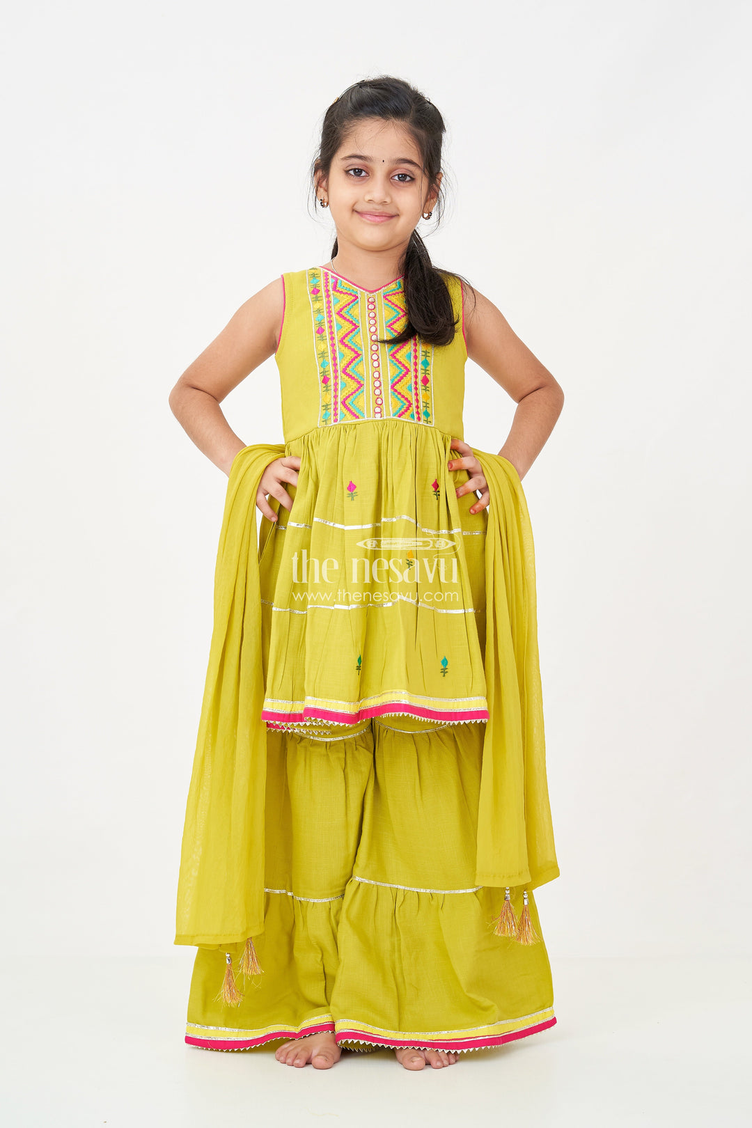 The Nesavu Girls Churidar Sets Girls Green Churidar Set with Thread Embroidered Sleeveless Kurta and Matching Flared Pants Nesavu Nesavu Girls Green Churidar Set with Embroidered Kurta and Matching Flared Pants in Soft Cotton