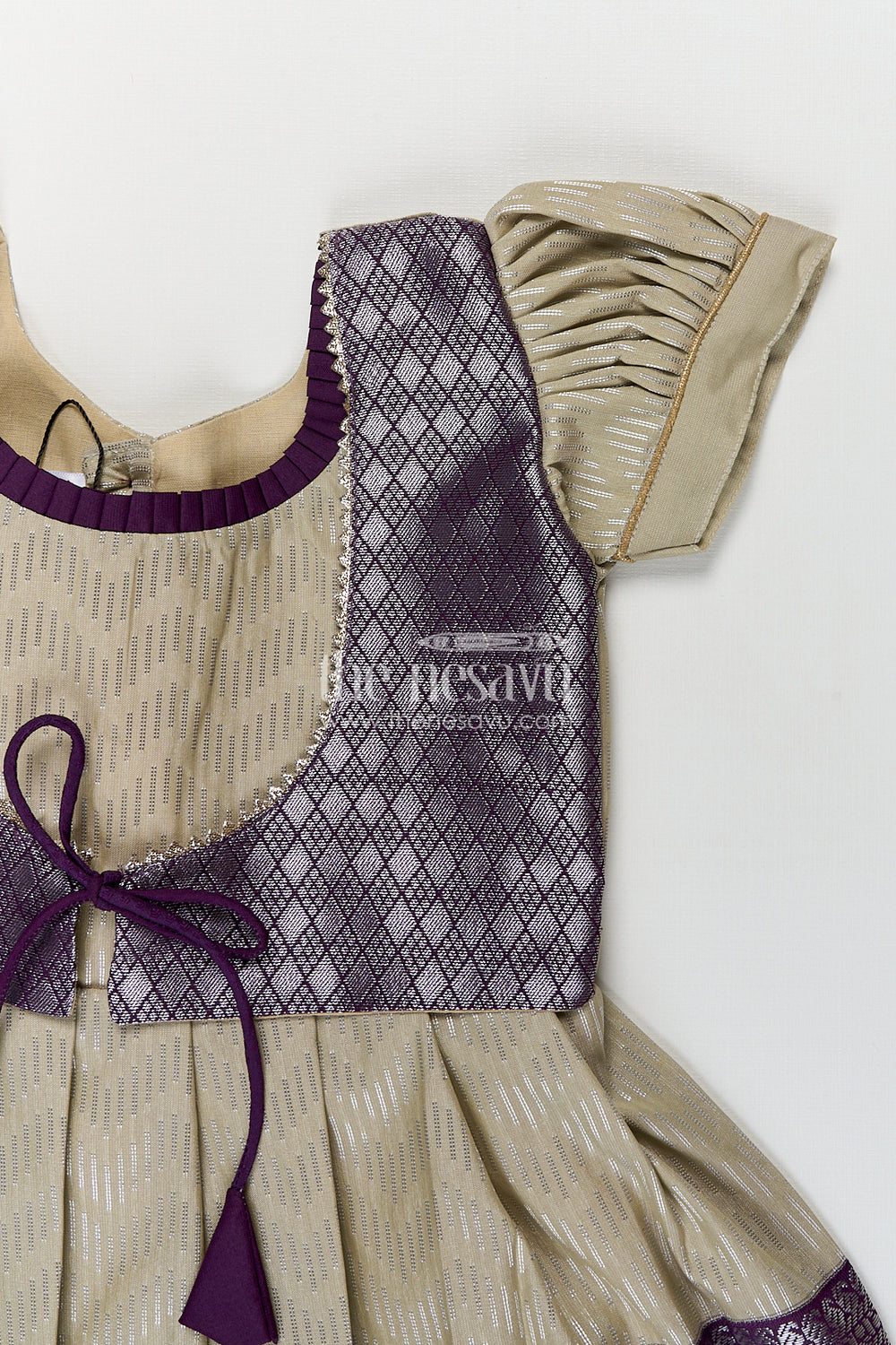 The Nesavu Girls Kanchi Silk Frock Girls Kanchivaram Frock Traditional in Cream and Purple with Puff Sleeves and Zari Woven Border Nesavu Nesavu Girls Frock Traditional Design Cream Kanchivaram Silk Purple Zari Border Puff Sleeves