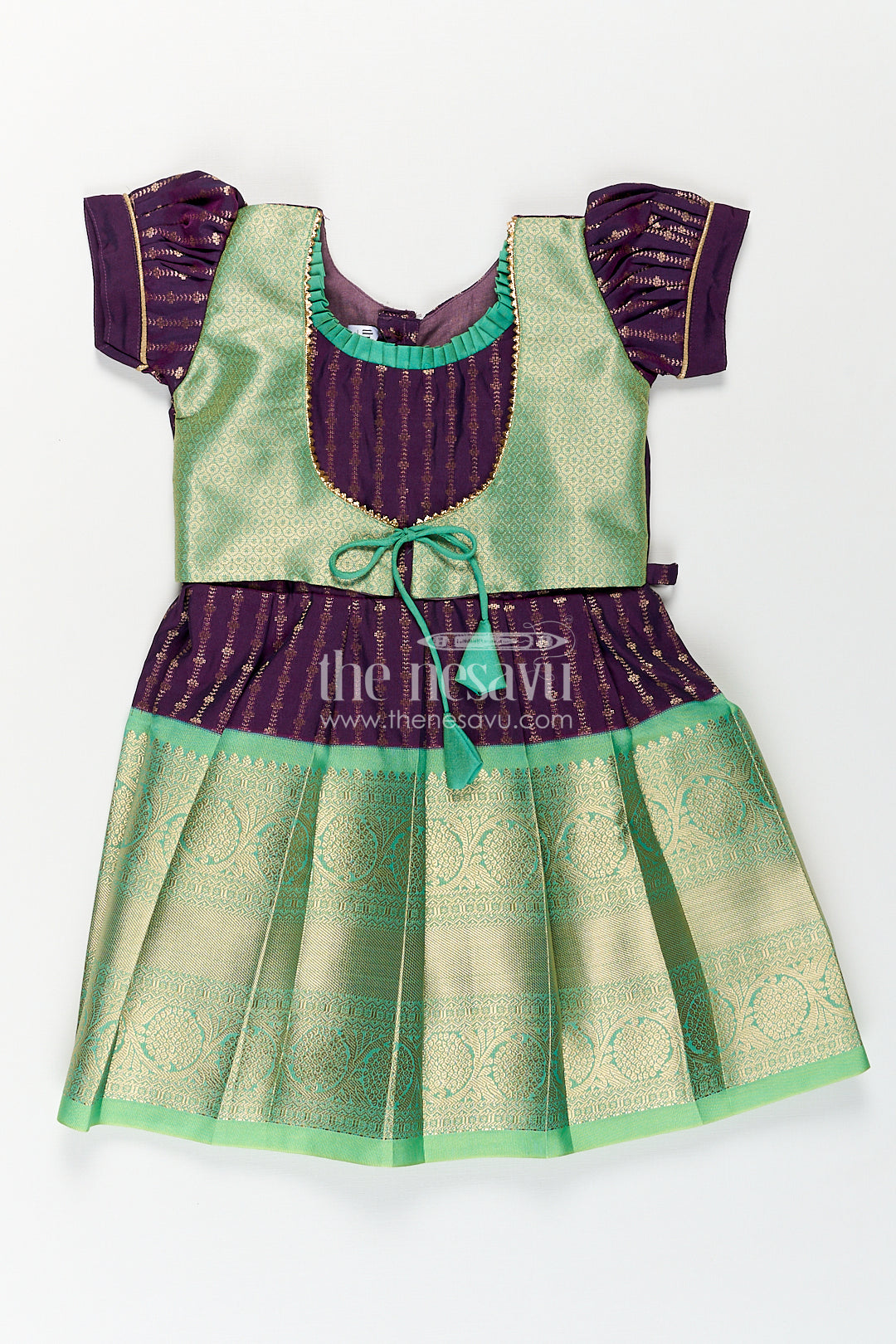 The Nesavu Girls Kanchi Silk Frock Girls Kanchivaram Long Green Frock with Puff Sleeves in Purple and Zari Woven Skirt and Overlay Detail Nesavu 14 (6M) / Green / Style 1 SF862AA-14 Nesavu Girls Long Green Frock Kanchivaram Silk Purple Bodice Zari Woven Pleated Skirt