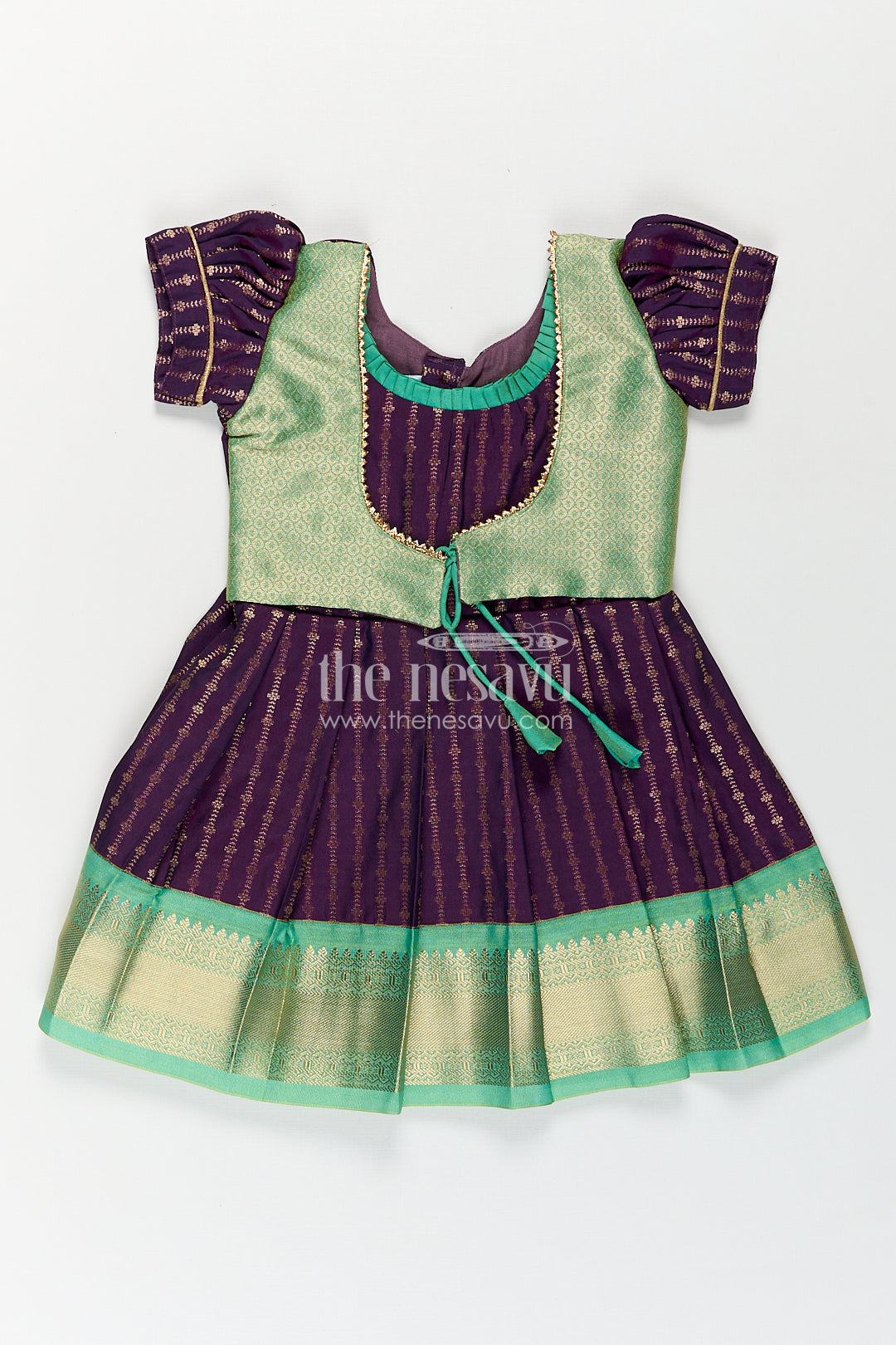 The Nesavu Girls Kanchi Silk Frock Girls Kanchivaram Long Green Frock with Puff Sleeves in Purple and Zari Woven Skirt and Overlay Detail Nesavu 14 (6M) / Green / Style 3 SF862AC-14 Nesavu Girls Long Green Frock Kanchivaram Silk Purple Bodice Zari Woven Pleated Skirt