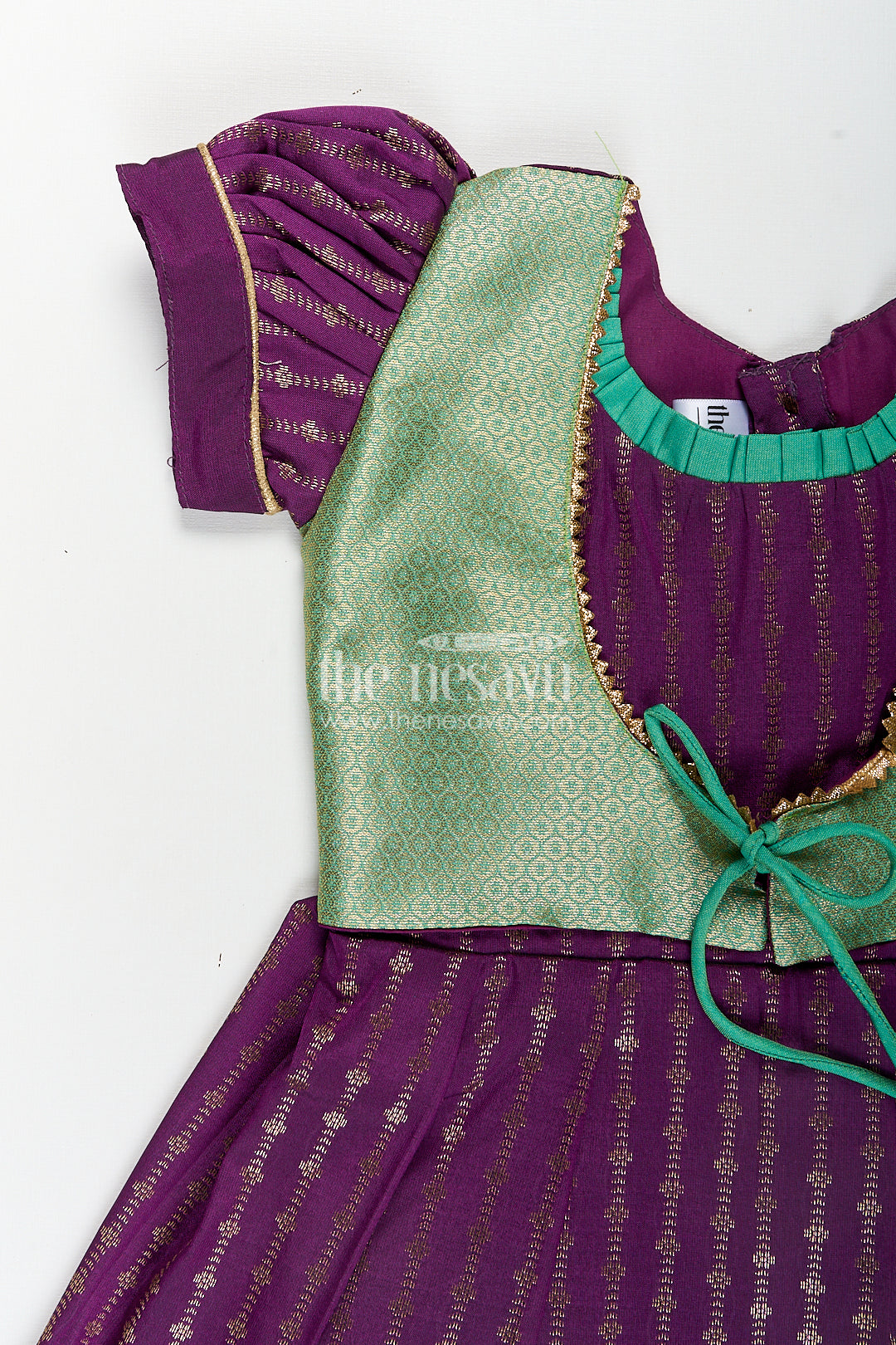 The Nesavu Girls Kanchi Silk Frock Girls Kanchivaram Long Green Frock with Puff Sleeves in Purple and Zari Woven Skirt and Overlay Detail Nesavu Nesavu Girls Long Green Frock Kanchivaram Silk Purple Bodice Zari Woven Pleated Skirt