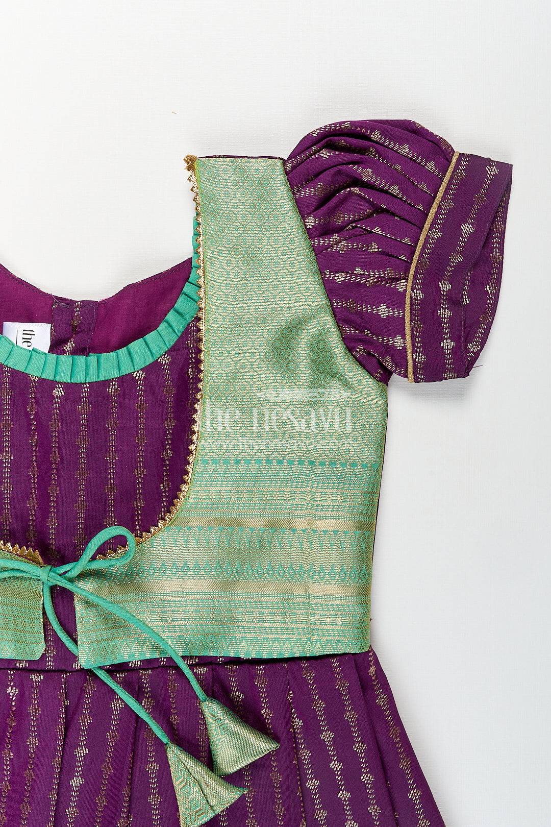 The Nesavu Girls Kanchi Silk Frock Girls Kanchivaram Long Green Frock with Puff Sleeves in Purple and Zari Woven Skirt and Overlay Detail Nesavu Nesavu Girls Long Green Frock Kanchivaram Silk Purple Bodice Zari Woven Pleated Skirt