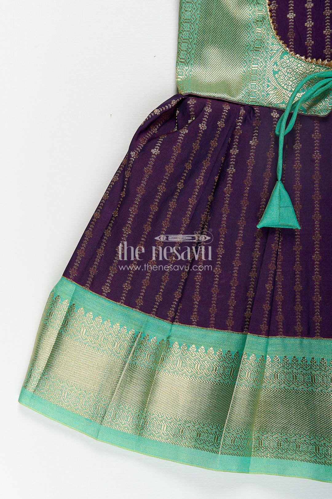 The Nesavu Girls Kanchi Silk Frock Girls Kanchivaram Long Green Frock with Puff Sleeves in Purple and Zari Woven Skirt and Overlay Detail Nesavu Nesavu Girls Long Green Frock Kanchivaram Silk Purple Bodice Zari Woven Pleated Skirt