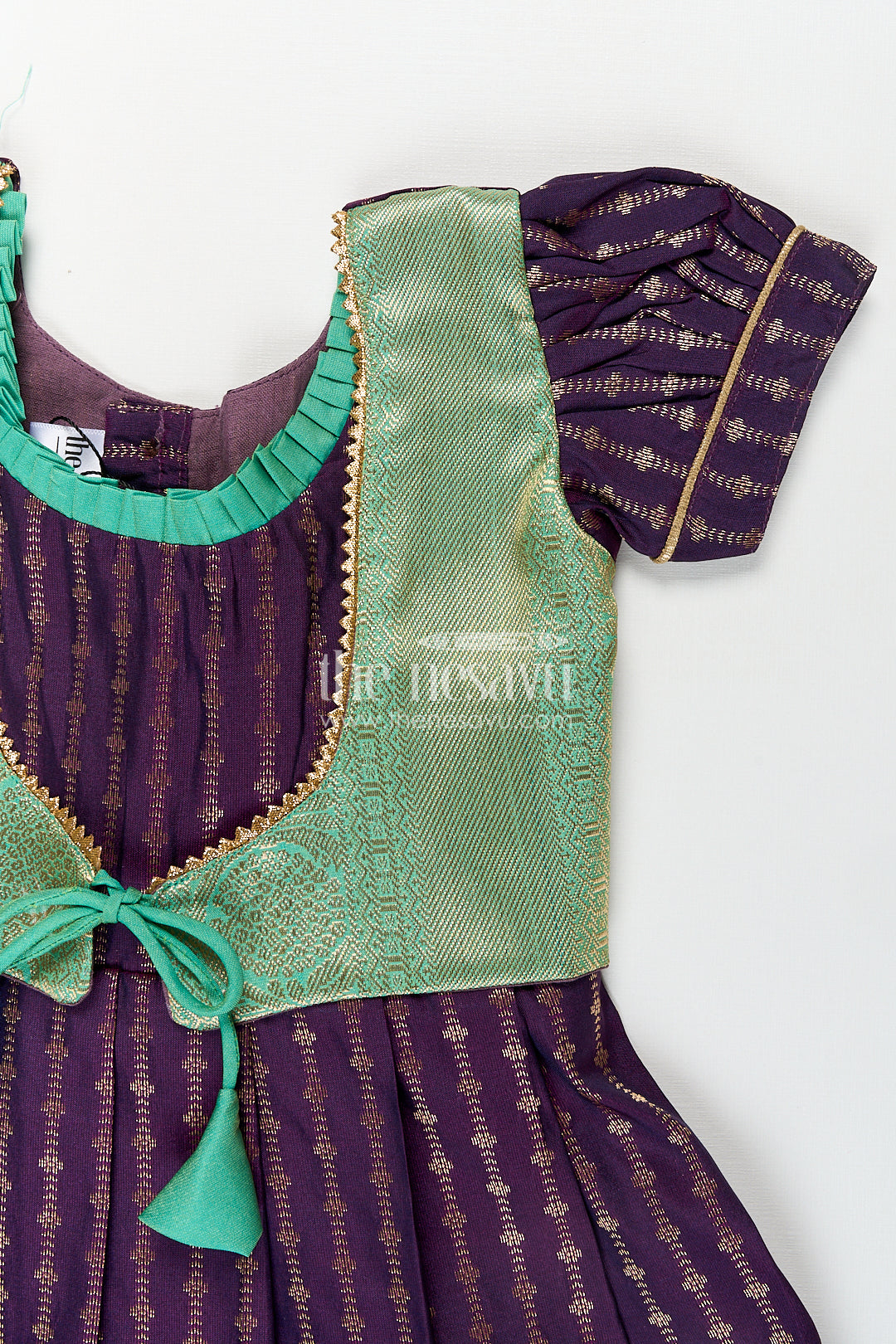 The Nesavu Girls Kanchi Silk Frock Girls Kanchivaram Long Green Frock with Puff Sleeves in Purple and Zari Woven Skirt and Overlay Detail Nesavu Nesavu Girls Long Green Frock Kanchivaram Silk Purple Bodice Zari Woven Pleated Skirt