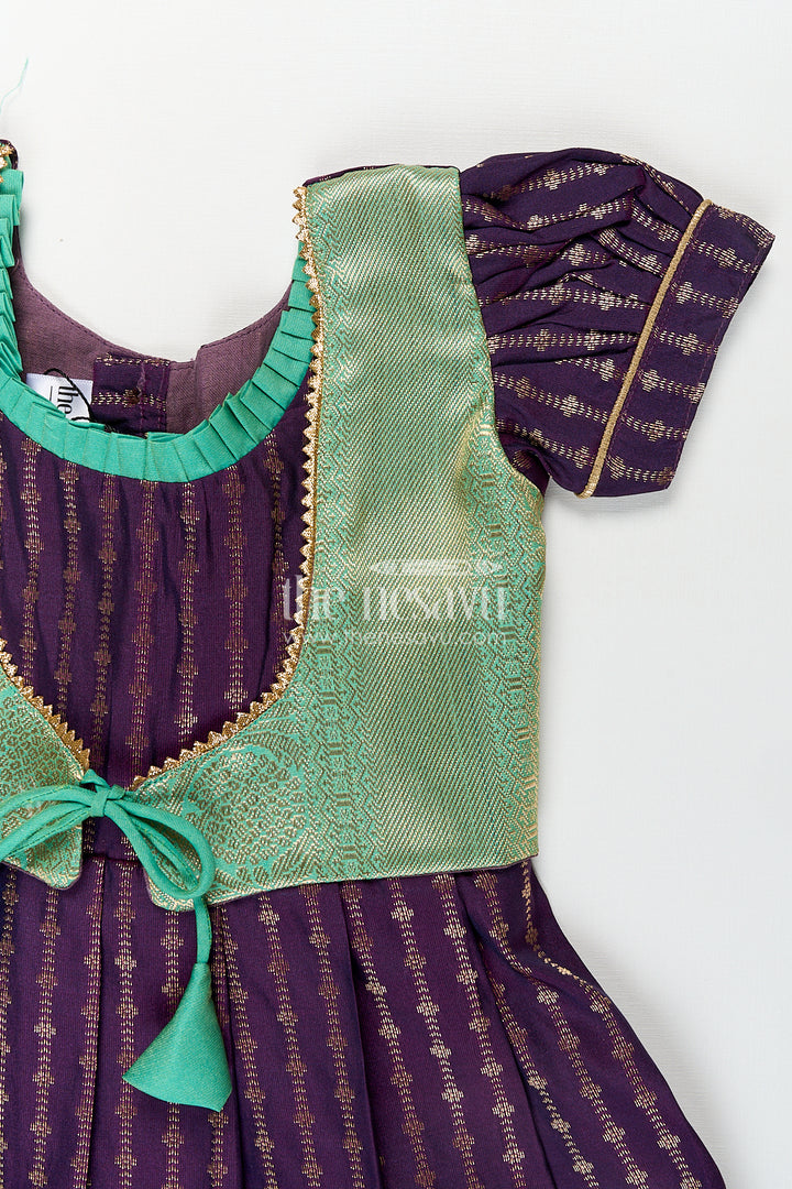 The Nesavu Girls Kanchi Silk Frock Girls Kanchivaram Long Green Frock with Puff Sleeves in Purple and Zari Woven Skirt and Overlay Detail Nesavu Nesavu Girls Long Green Frock Kanchivaram Silk Purple Bodice Zari Woven Pleated Skirt