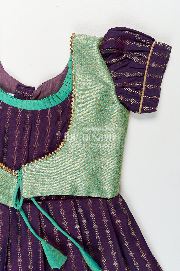 The Nesavu Girls Kanchi Silk Frock Girls Kanchivaram Long Green Frock with Puff Sleeves in Purple and Zari Woven Skirt and Overlay Detail Nesavu Nesavu Girls Long Green Frock Kanchivaram Silk Purple Bodice Zari Woven Pleated Skirt