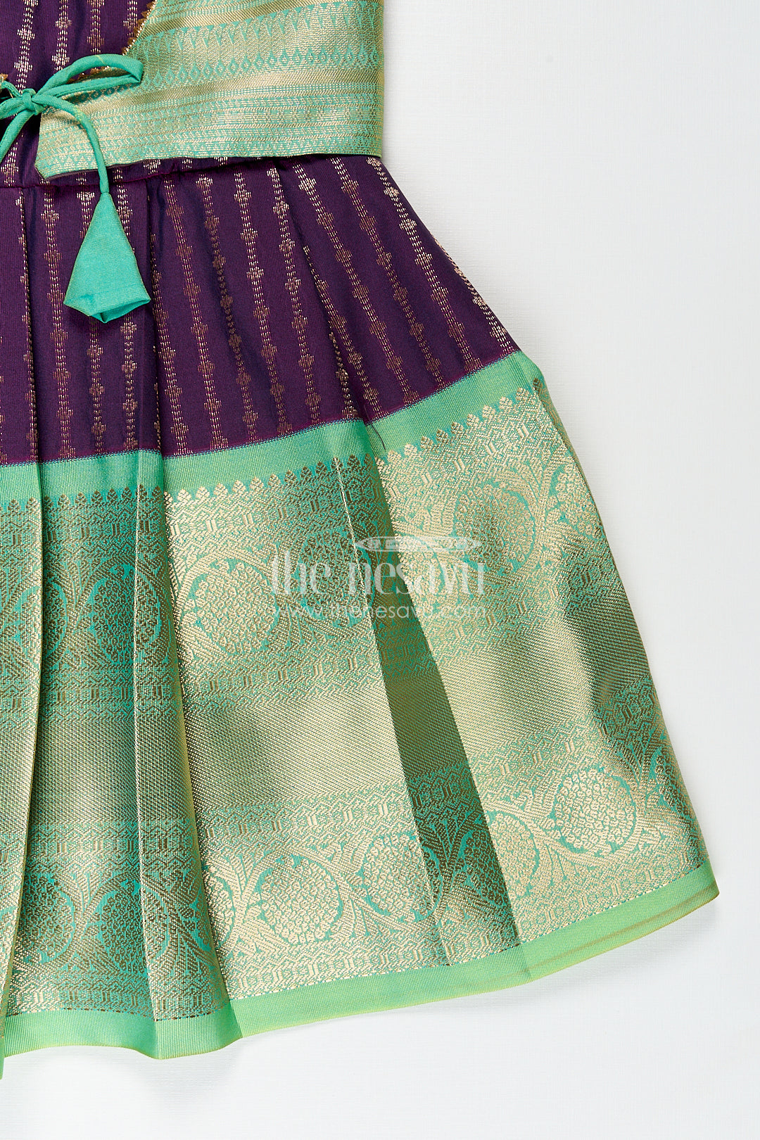 The Nesavu Girls Kanchi Silk Frock Girls Kanchivaram Long Green Frock with Puff Sleeves in Purple and Zari Woven Skirt and Overlay Detail Nesavu Nesavu Girls Long Green Frock Kanchivaram Silk Purple Bodice Zari Woven Pleated Skirt