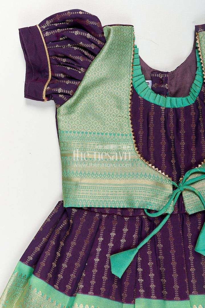 The Nesavu Girls Kanchi Silk Frock Girls Kanchivaram Long Green Frock with Puff Sleeves in Purple and Zari Woven Skirt and Overlay Detail Nesavu Nesavu Girls Long Green Frock Kanchivaram Silk Purple Bodice Zari Woven Pleated Skirt
