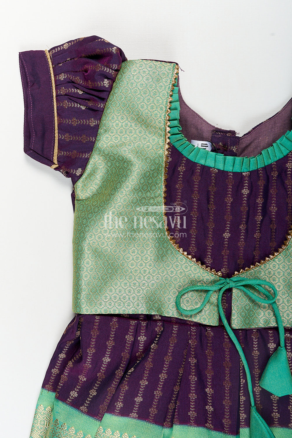 The Nesavu Girls Kanchi Silk Frock Girls Kanchivaram Long Green Frock with Puff Sleeves in Purple and Zari Woven Skirt and Overlay Detail Nesavu Nesavu Girls Long Green Frock Kanchivaram Silk Purple Bodice Zari Woven Pleated Skirt