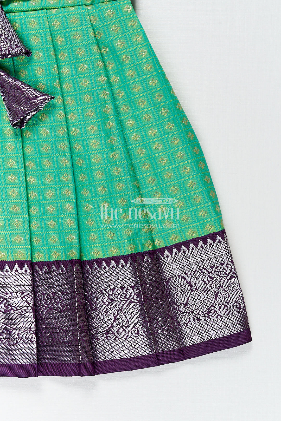 The Nesavu Girls Kanchi Silk Frock Girls Kanchivaram Silk Cotton Frocks with Puff Sleeves Green Bodice and Purple Zari Woven Skirt Nesavu Nesavu Girls Silk Cotton Frocks Kanchivaram Style Purple Zari Skirt Green Puff Sleeve Bodice