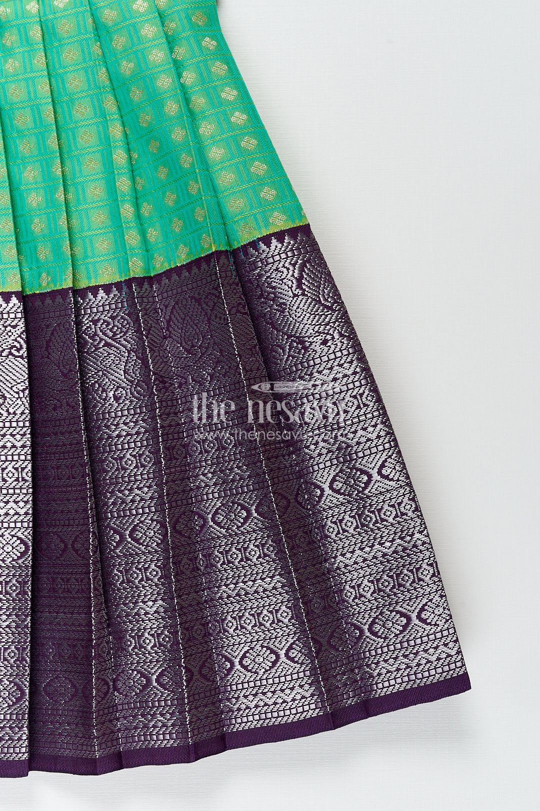 The Nesavu Girls Kanchi Silk Frock Girls Kanchivaram Silk Cotton Frocks with Puff Sleeves Green Bodice and Purple Zari Woven Skirt Nesavu Nesavu Girls Silk Cotton Frocks Kanchivaram Style Purple Zari Skirt Green Puff Sleeve Bodice