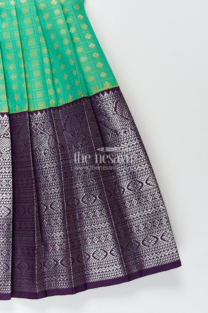 The Nesavu Girls Kanchi Silk Frock Girls Kanchivaram Silk Cotton Frocks with Puff Sleeves Green Bodice and Purple Zari Woven Skirt Nesavu Nesavu Girls Silk Cotton Frocks Kanchivaram Style Purple Zari Skirt Green Puff Sleeve Bodice