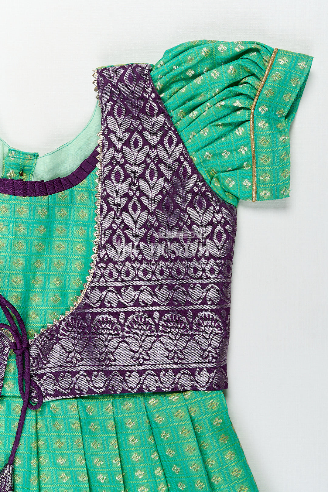 The Nesavu Girls Kanchi Silk Frock Girls Kanchivaram Silk Cotton Frocks with Puff Sleeves Green Bodice and Purple Zari Woven Skirt Nesavu Nesavu Girls Silk Cotton Frocks Kanchivaram Style Purple Zari Skirt Green Puff Sleeve Bodice