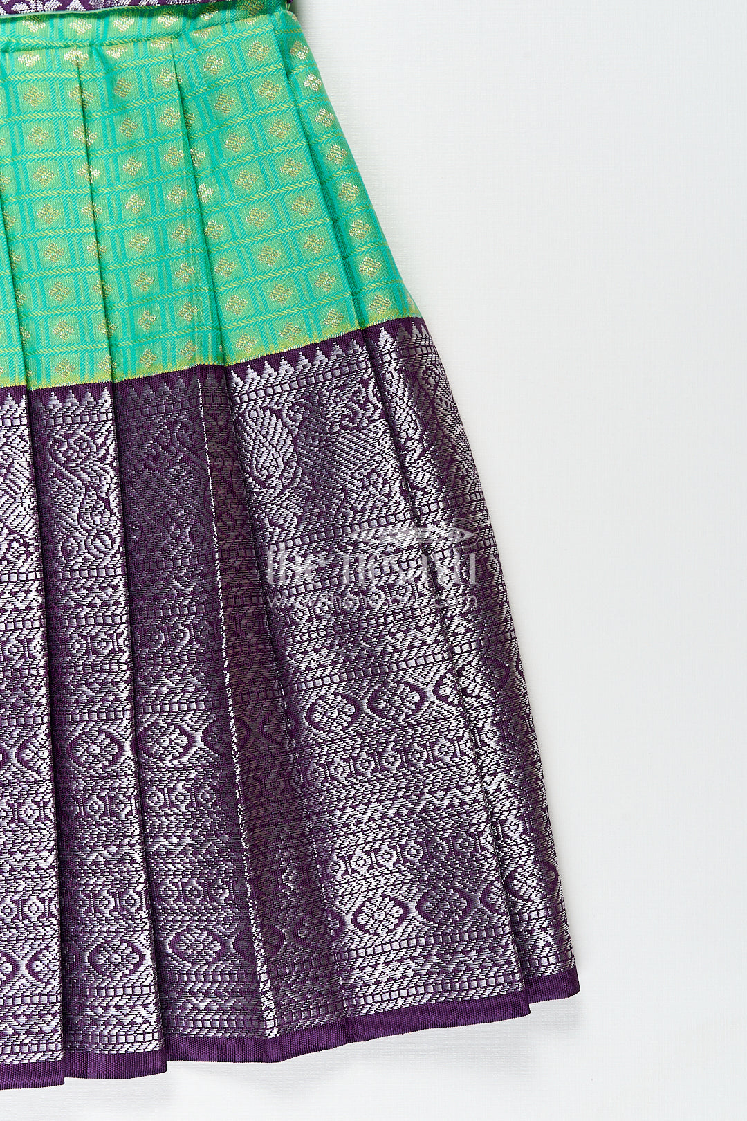 The Nesavu Girls Kanchi Silk Frock Girls Kanchivaram Silk Cotton Frocks with Puff Sleeves Green Bodice and Purple Zari Woven Skirt Nesavu Nesavu Girls Silk Cotton Frocks Kanchivaram Style Purple Zari Skirt Green Puff Sleeve Bodice