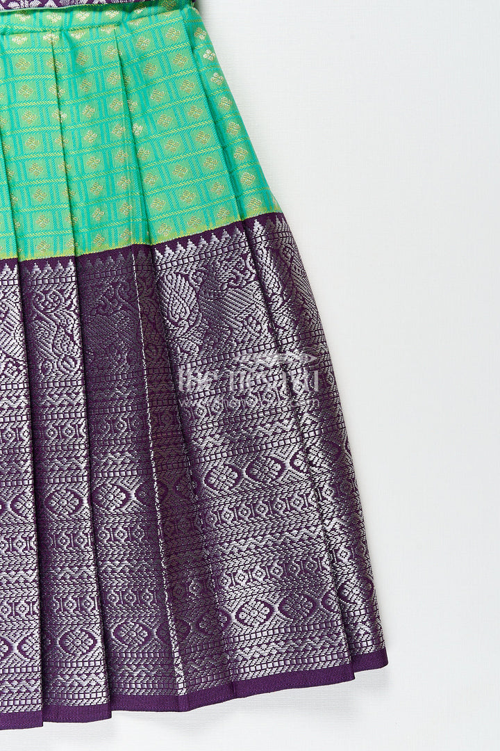 The Nesavu Girls Kanchi Silk Frock Girls Kanchivaram Silk Cotton Frocks with Puff Sleeves Green Bodice and Purple Zari Woven Skirt Nesavu Nesavu Girls Silk Cotton Frocks Kanchivaram Style Purple Zari Skirt Green Puff Sleeve Bodice
