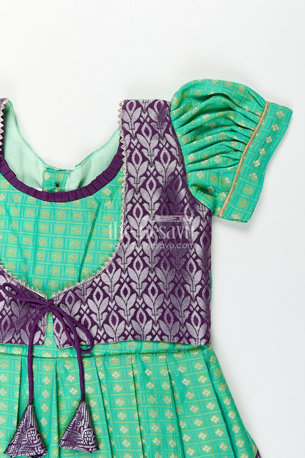The Nesavu Girls Kanchi Silk Frock Girls Kanchivaram Silk Cotton Frocks with Puff Sleeves Green Bodice and Purple Zari Woven Skirt Nesavu Nesavu Girls Silk Cotton Frocks Kanchivaram Style Purple Zari Skirt Green Puff Sleeve Bodice