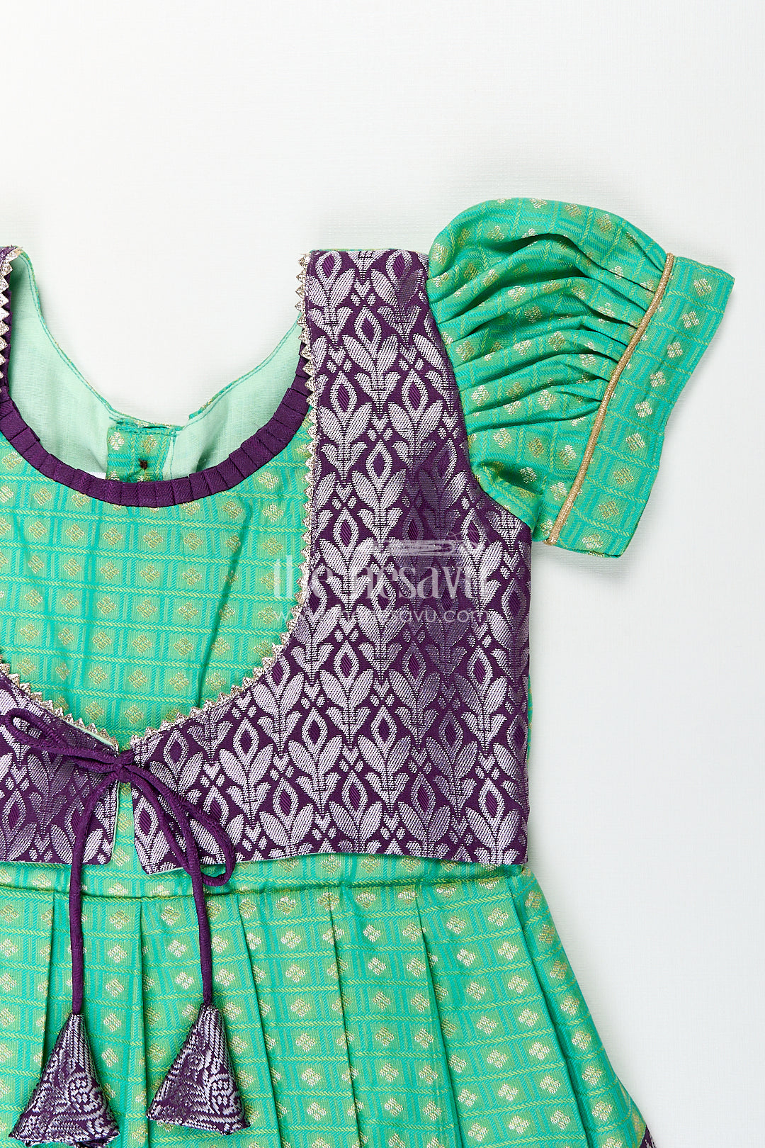The Nesavu Girls Kanchi Silk Frock Girls Kanchivaram Silk Cotton Frocks with Puff Sleeves Green Bodice and Purple Zari Woven Skirt Nesavu Nesavu Girls Silk Cotton Frocks Kanchivaram Style Purple Zari Skirt Green Puff Sleeve Bodice