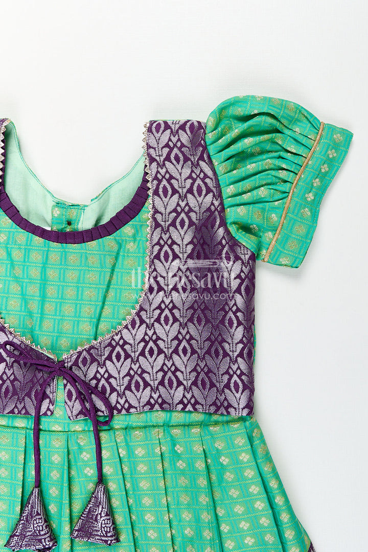 The Nesavu Girls Kanchi Silk Frock Girls Kanchivaram Silk Cotton Frocks with Puff Sleeves Green Bodice and Purple Zari Woven Skirt Nesavu Nesavu Girls Silk Cotton Frocks Kanchivaram Style Purple Zari Skirt Green Puff Sleeve Bodice