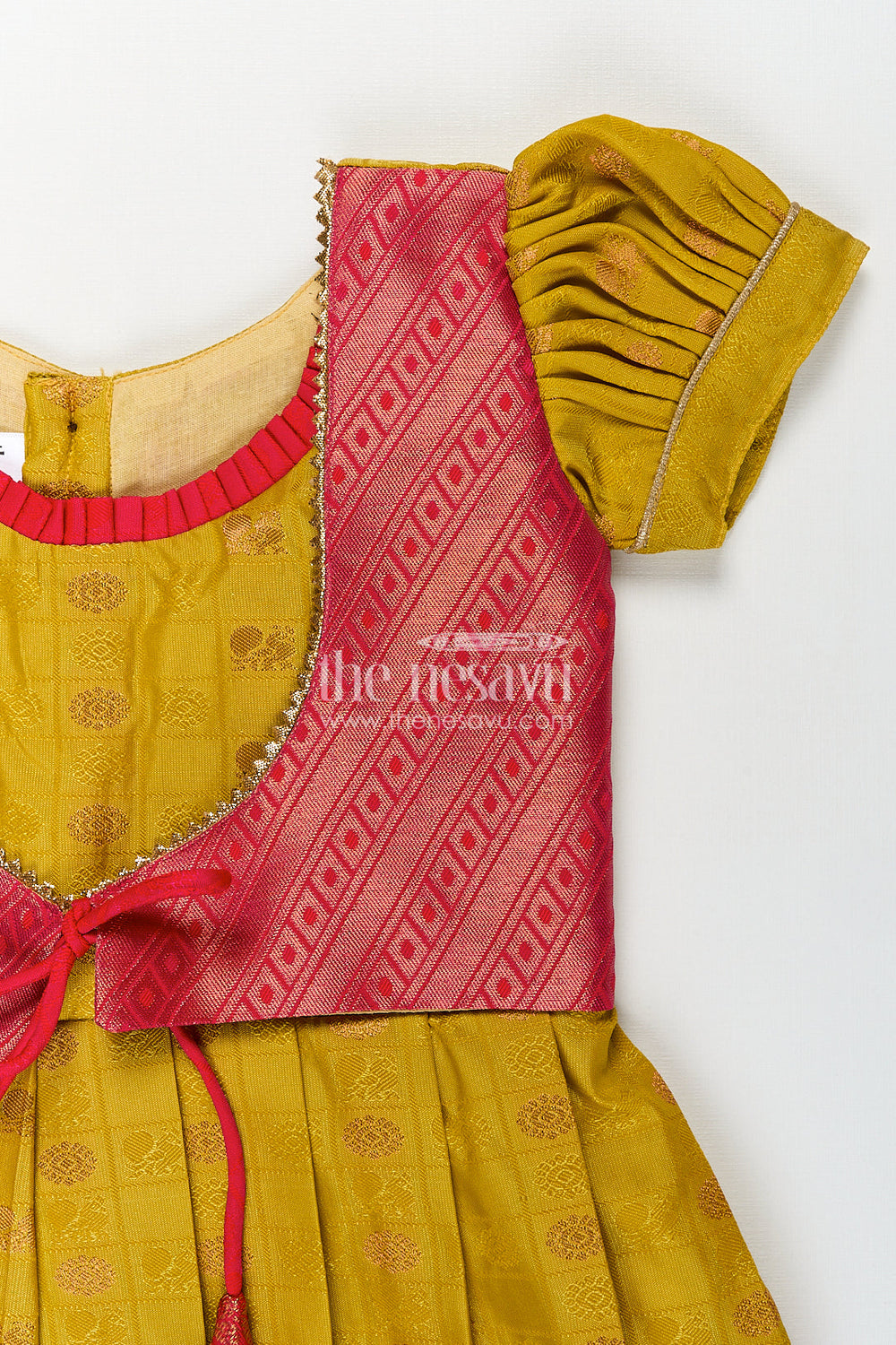 The Nesavu Girls Kanchi Silk Frock Girls Kanchivaram Yellow Silk Frock with Puff Sleeves and Contrast Maroon Zari Woven Border Design Nesavu Nesavu Girls Yellow Silk Frock Kanchivaram Style Maroon Zari Border Puff Sleeve Detailing