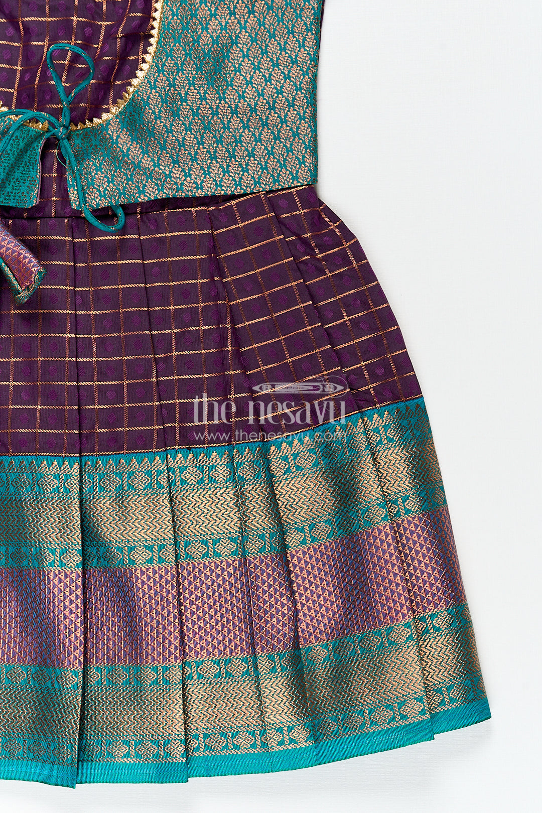 The Nesavu Silk Frock Girls Long Silk Frock Design in Semi Kanchivaram with Green Brocade Yoke and Purple Checked Pleated Skirt Nesavu Nesavu Girls Semi Kanchivaram Long Silk Frock Green Brocade Yoke Purple Checked Pleated Skirt