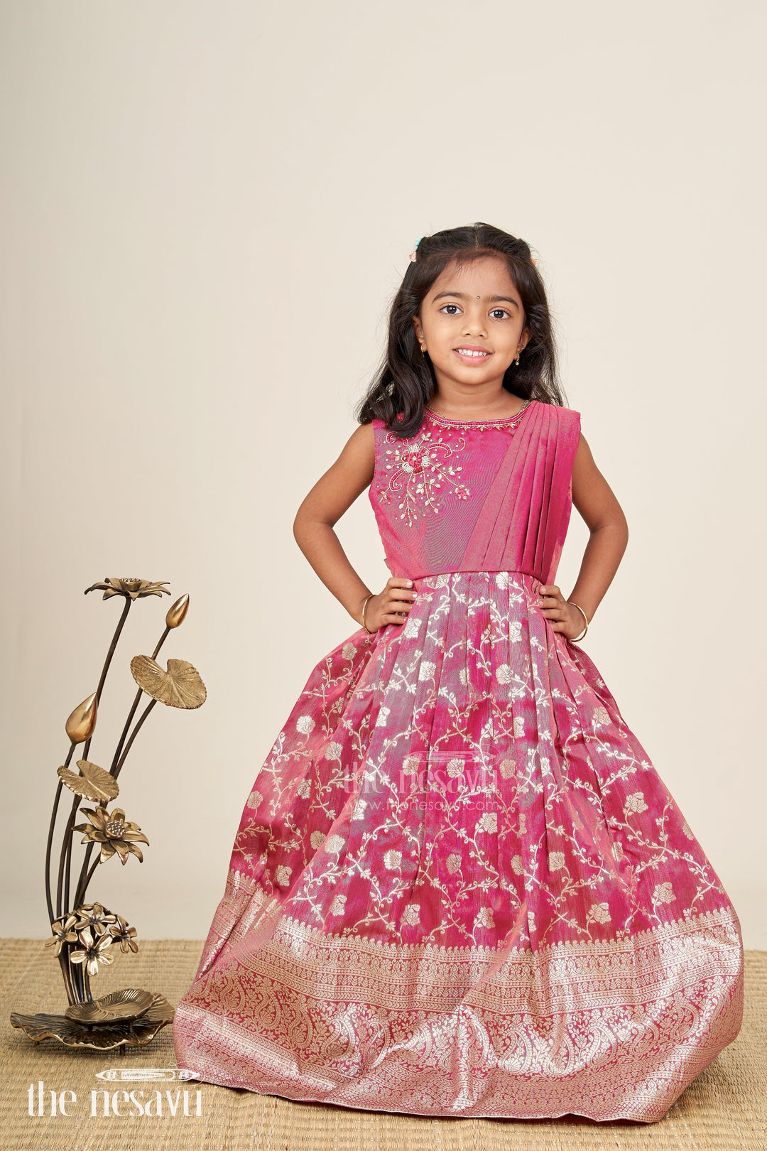 The Nesavu Girls Silk Gown Girls magenta Kora tissue silk Anarkali with big zari border Nesavu Nesavu girls magenta Kora tissue silk Anarkali with big zari border festive ethnic dress