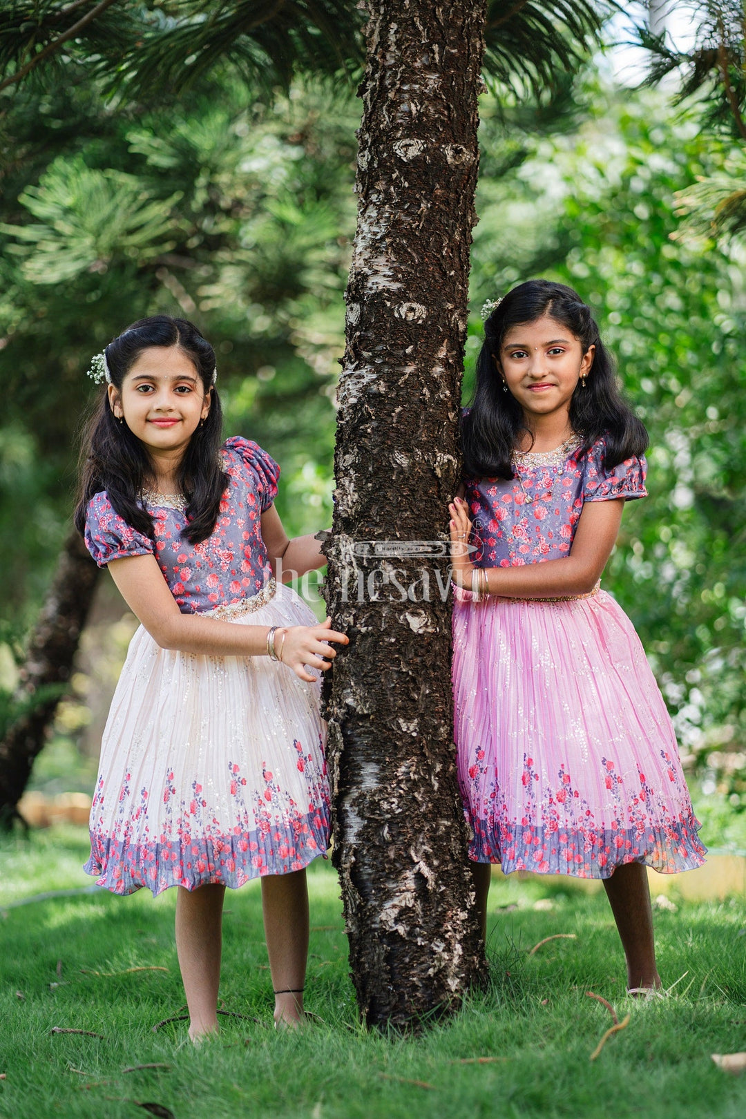 The Nesavu Silk Party Frock Girls Multicolor Floral Silk Party Frock with Puff Sleeves and Pleated Skirt Nesavu Nesavu Multicolor Floral Silk Party Frock Puff Sleeves Embellished Waistline Girls