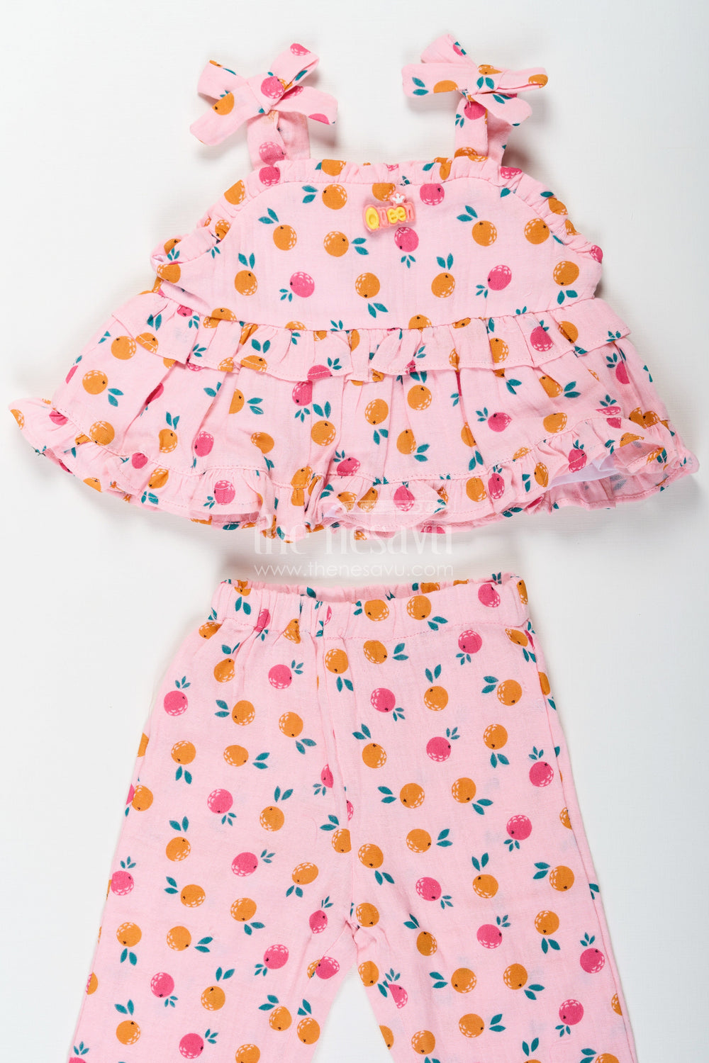 The Nesavu Girls Casual Set Girls Muslin Pink Ethnic Wear Set with Ruffle Top and Printed Pants for Comfortable Everyday Style Nesavu Nesavu Girls Muslin Printed Pink Ethnic Wear Set with Ruffle Top and Matching Pants for Daily Comfort