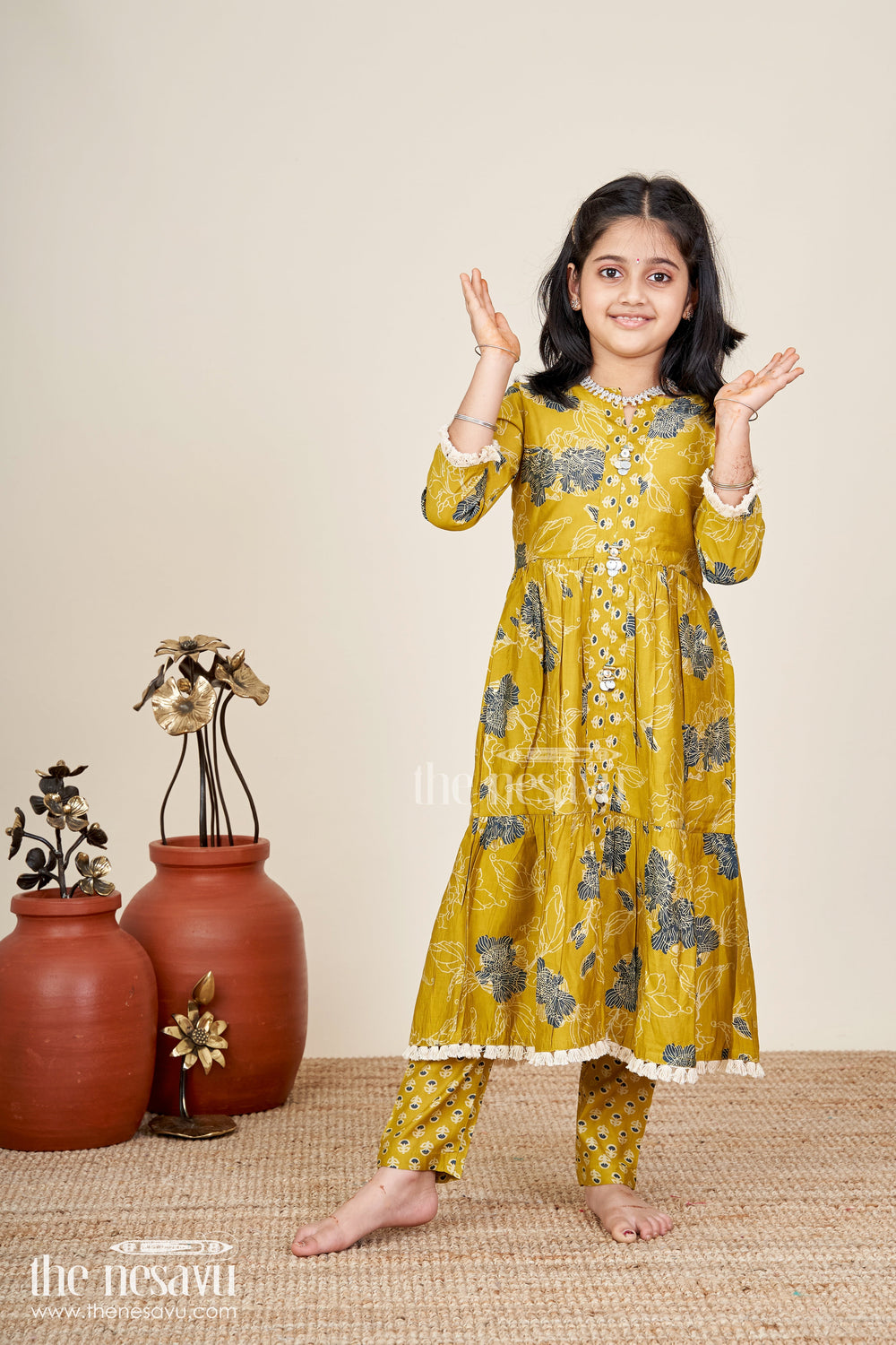The Nesavu Girls Sharara / Plazo Set Girls mustard sharara set with black floral print for festive wear Nesavu Nesavu girls mustard sharara set with floral digital print and button-front kurti