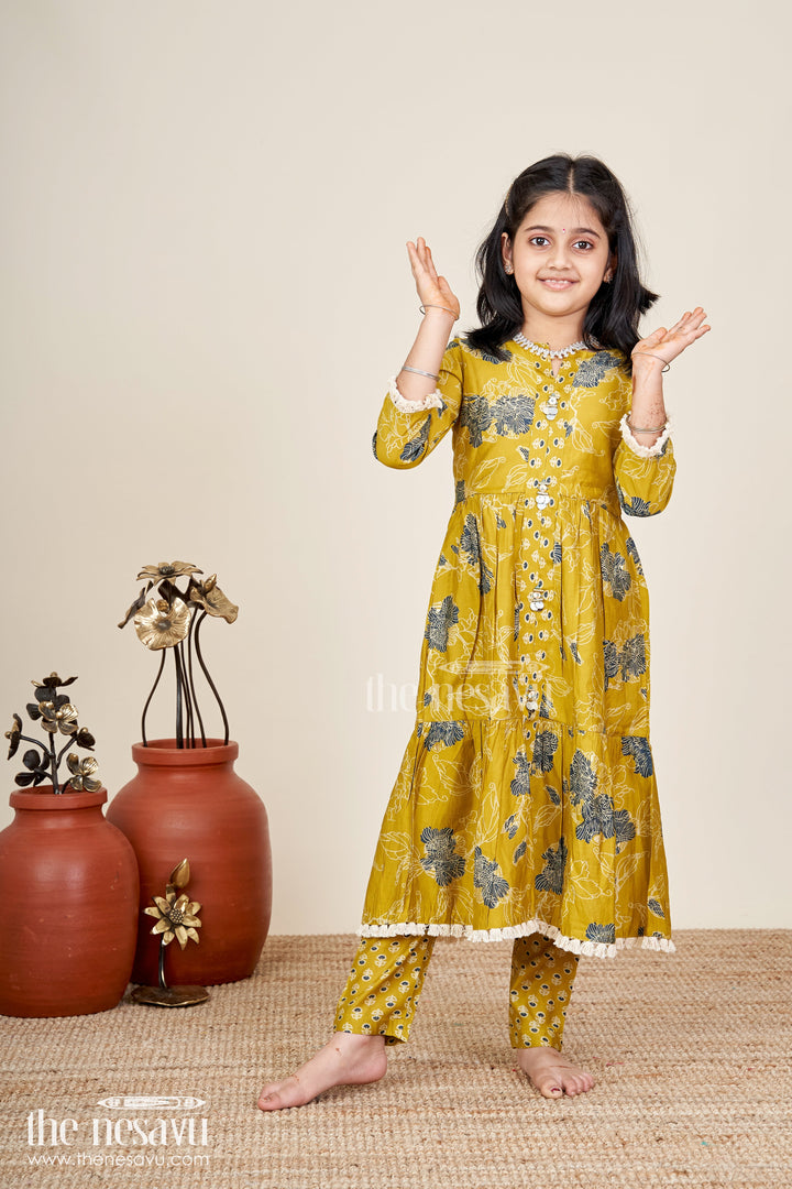 The Nesavu Girls Sharara / Plazo Set Girls mustard sharara set with black floral print for festive wear Nesavu Nesavu girls mustard sharara set with floral digital print and button-front kurti