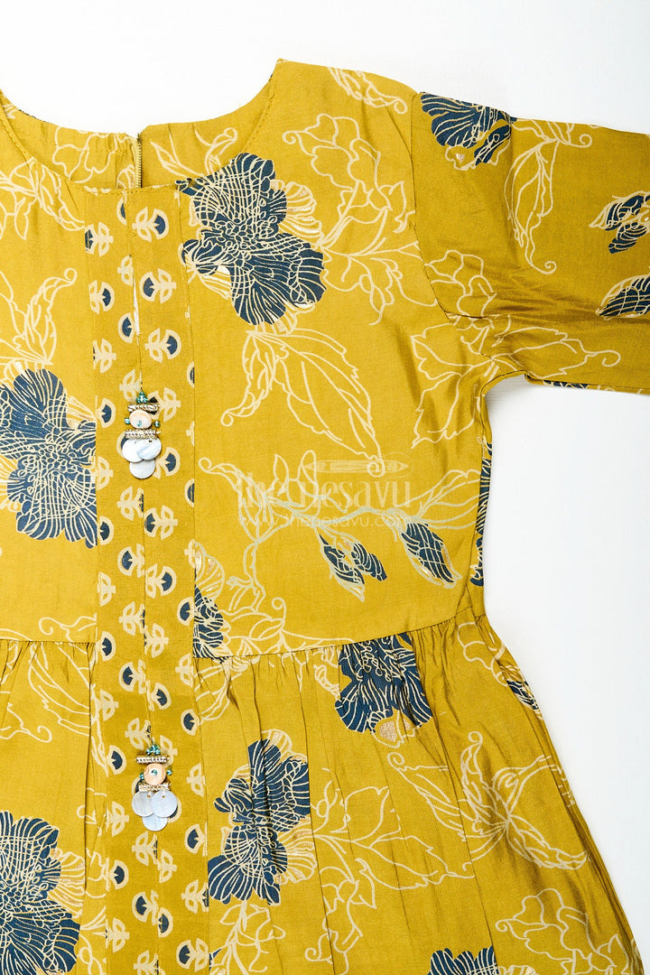 The Nesavu Girls Sharara / Plazo Set Girls mustard sharara set with black floral print for festive wear Nesavu Nesavu girls mustard sharara set with floral digital print and button-front kurti