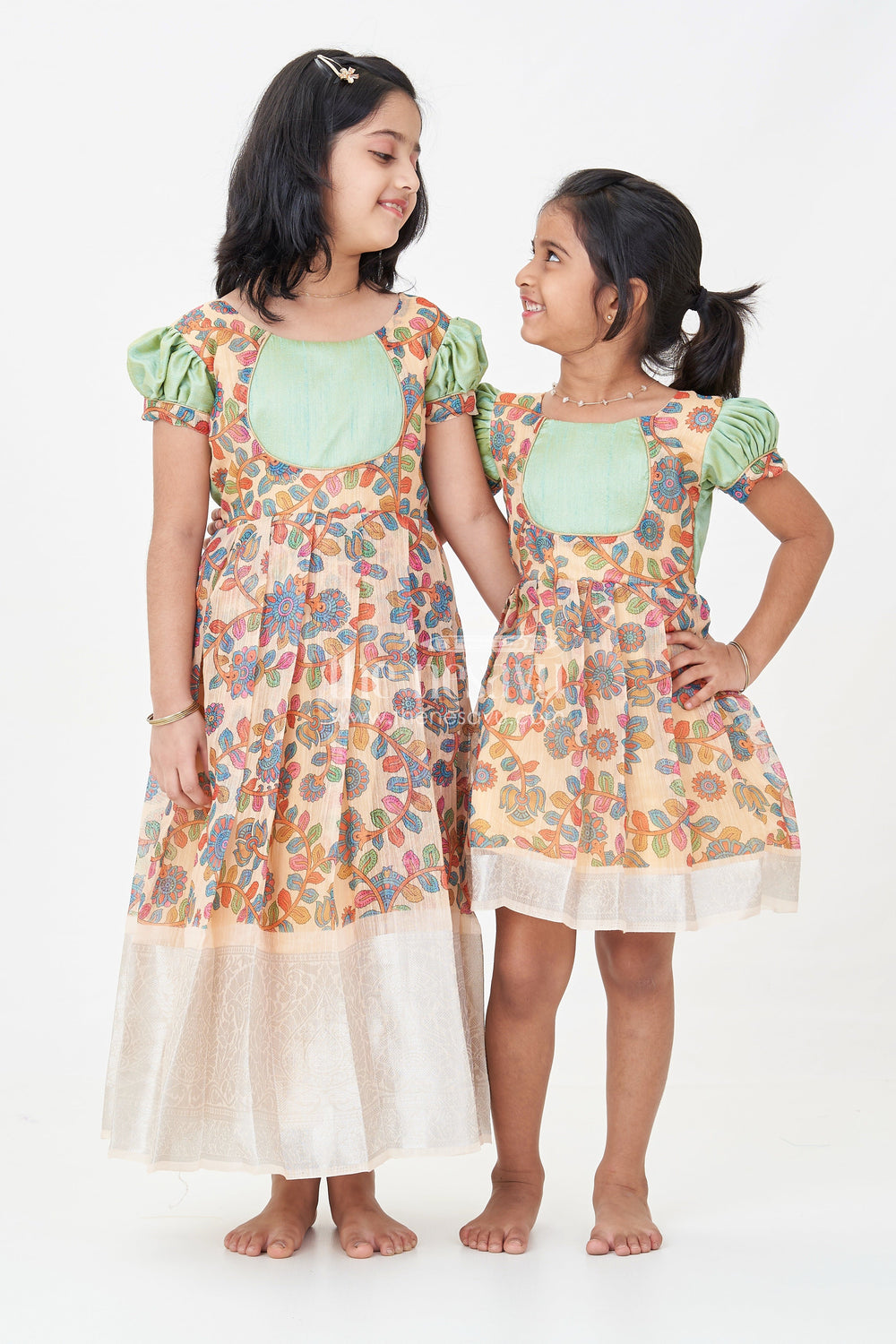 The Nesavu Silk Frock Girls New Dress Collection in Printed Chanderi Cotton with Raw Silk Yoke and Short Puff Sleeves Nesavu Nesavu New Dress Collection Girls Chanderi Cotton Raw Silk Yoke Floral Print