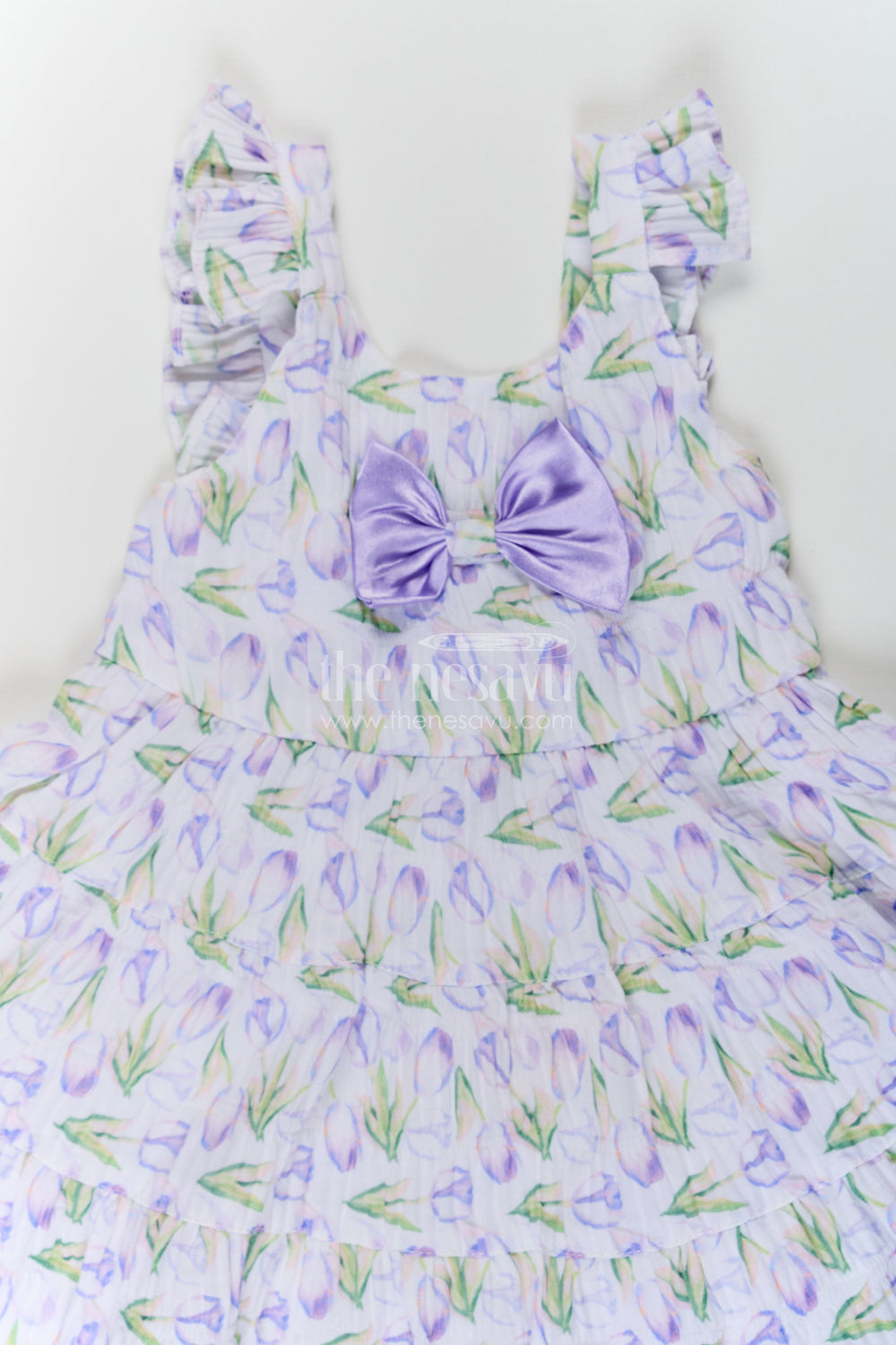 The Nesavu Baby Fancy Frock Girls Purple Floral Frocks with Sleeves in Chiffon Featuring Layered Ruffles and Bow Detail Nesavu Nesavu Girls Purple Floral Printed Chiffon Frocks Sleeves Layered Ruffles