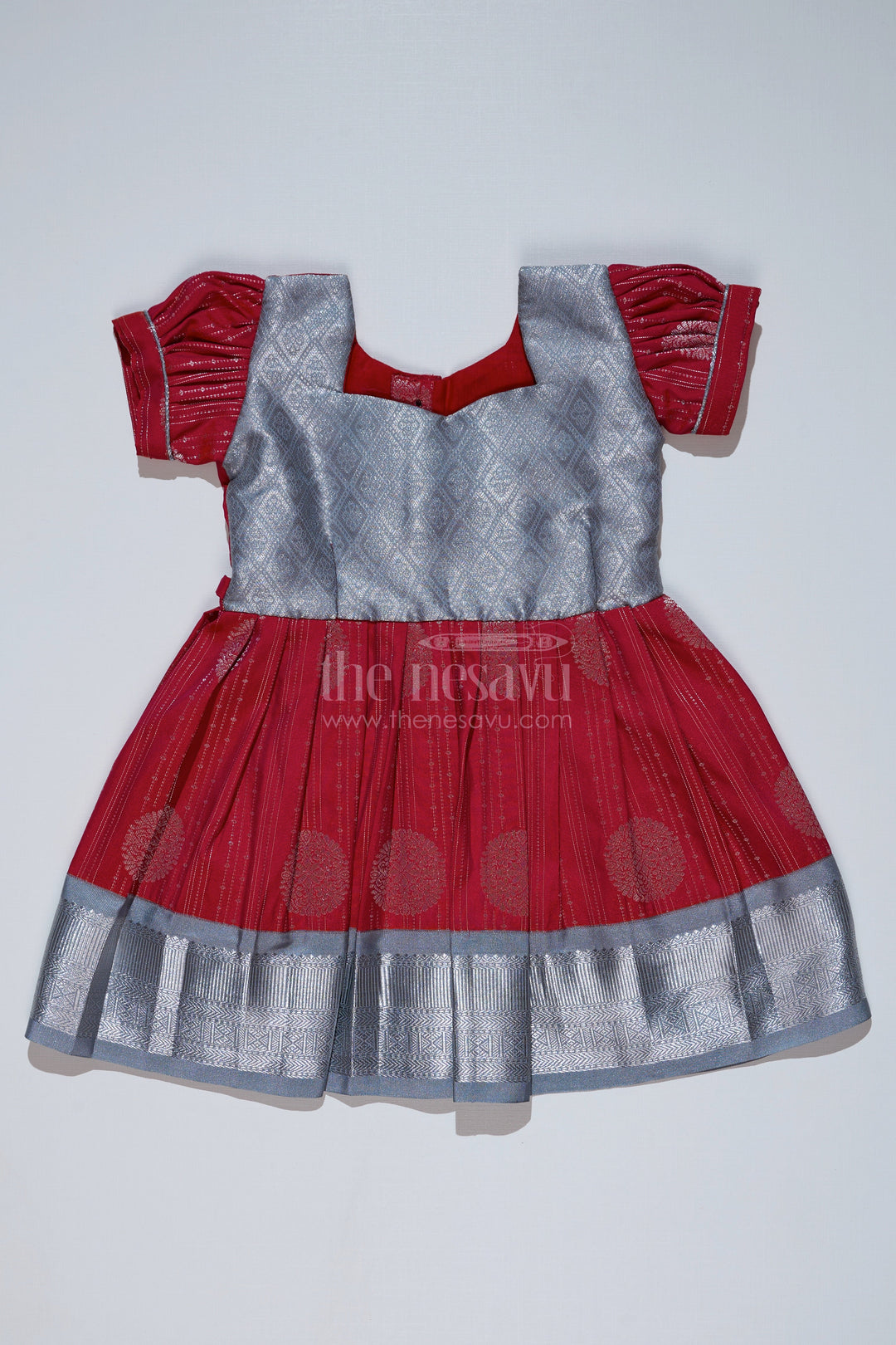 The Nesavu Girls Kanchi Silk Frock Girls Red and Silver Pattu Pavadai with Zari Border and Elegant Pleated Skirt Available Online Nesavu Nesavu Girls Red Silver Pattu Pavadai Zari Border Elegant Pleated Skirt Online