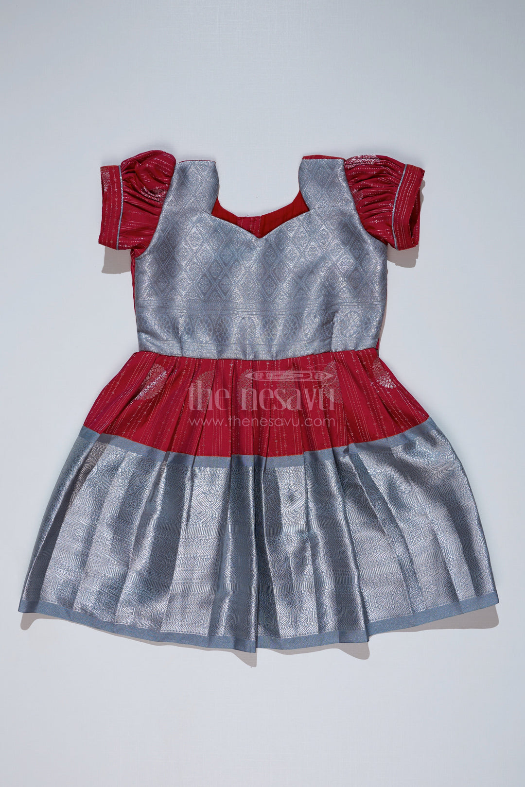 The Nesavu Girls Kanchi Silk Frock Girls Red and Silver Pattu Pavadai with Zari Border and Elegant Pleated Skirt Available Online Nesavu Nesavu Girls Red Silver Pattu Pavadai Zari Border Elegant Pleated Skirt Online