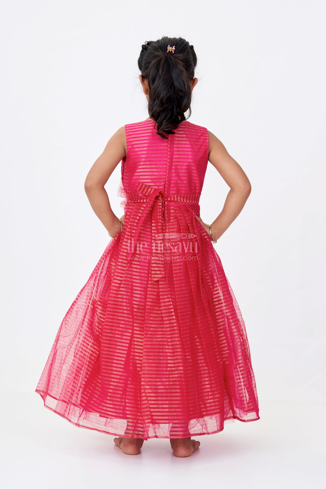 The Nesavu Girls Silk Gown Girls Red Silk Gown in Soft Net with Stripe Design and Oversized Floral Waist Embellishment Nesavu Nesavu Girls Red Silk Gown Soft Net Gold Stripes Waist Flower Detail