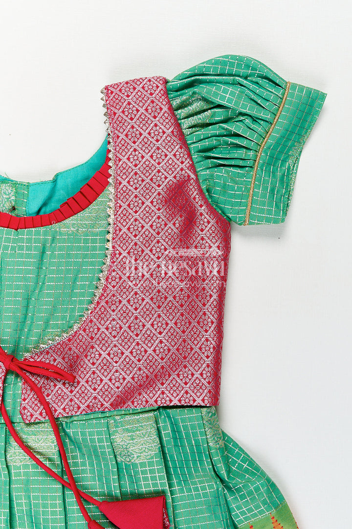 The Nesavu Silk Frock Girls Silk Material Frock Design in Semi Kanchivaram with Green Pleated Skirt and Pink Brocade Yoke Nesavu Nesavu Girls Semi Kanchivaram Silk Material Frock Design Green Body Pink Brocade Yoke Detailing