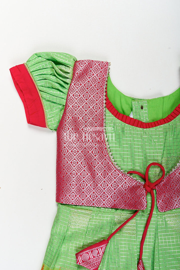 The Nesavu Silk Frock Girls Silky Long Frock in Semi Kanchivaram with Rich Pink Zari Pleats and Green Patterned Bodice Nesavu Nesavu Girls Silky Long Frock Semi Kanchivaram Green Bodice Pink Zari Border Pleated Skirt
