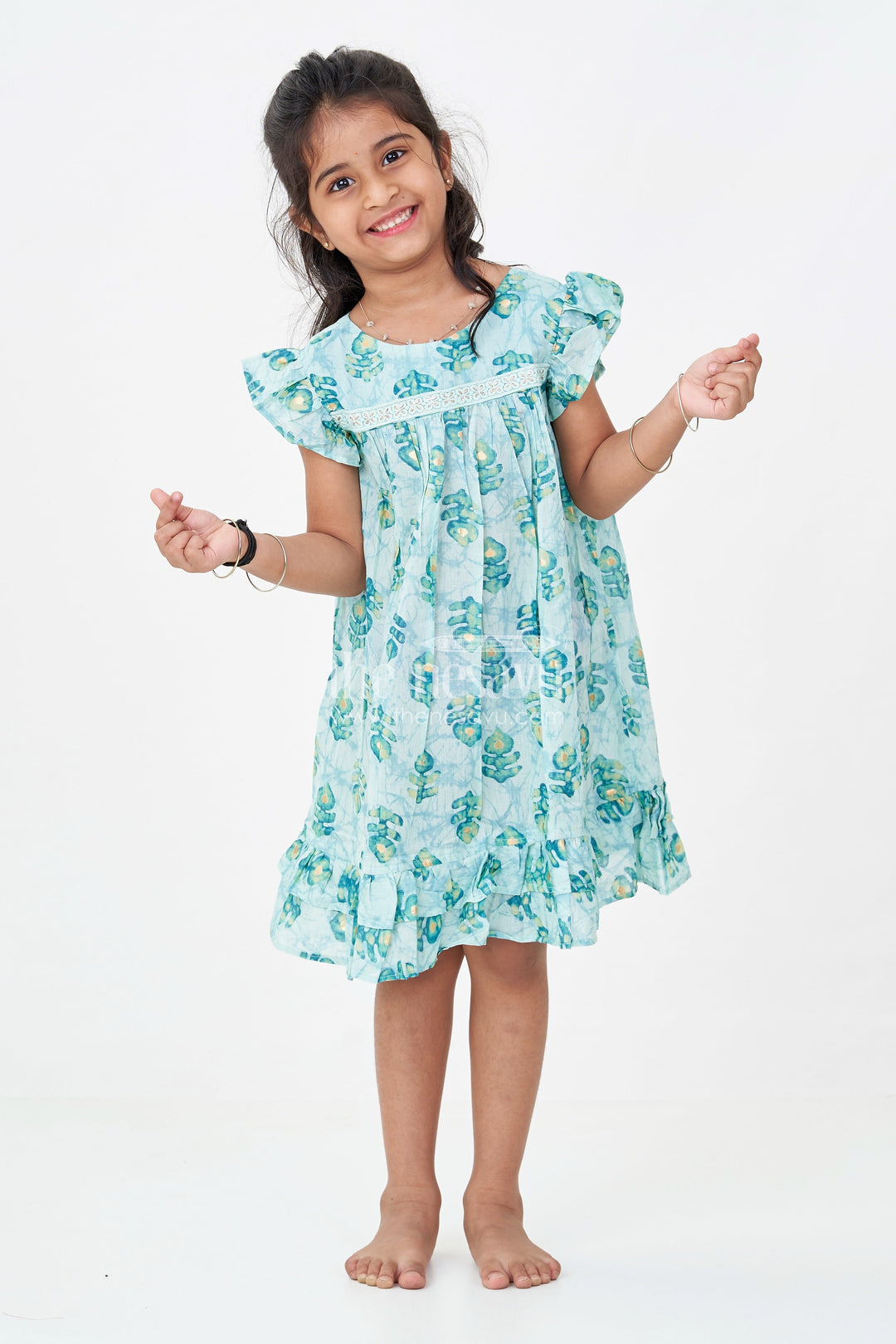 The Nesavu Girls Fancy Frock Girls Sky Blue Frock Design in Rayon with Leaf Motifs and Ruffle Accents for Whimsical Wear Nesavu 18 (2Y) / Blue GFC1761B-18 Nesavu Girls Sky Blue Frock Design Rayon Green Leaf Digital Print Ruffle Hem