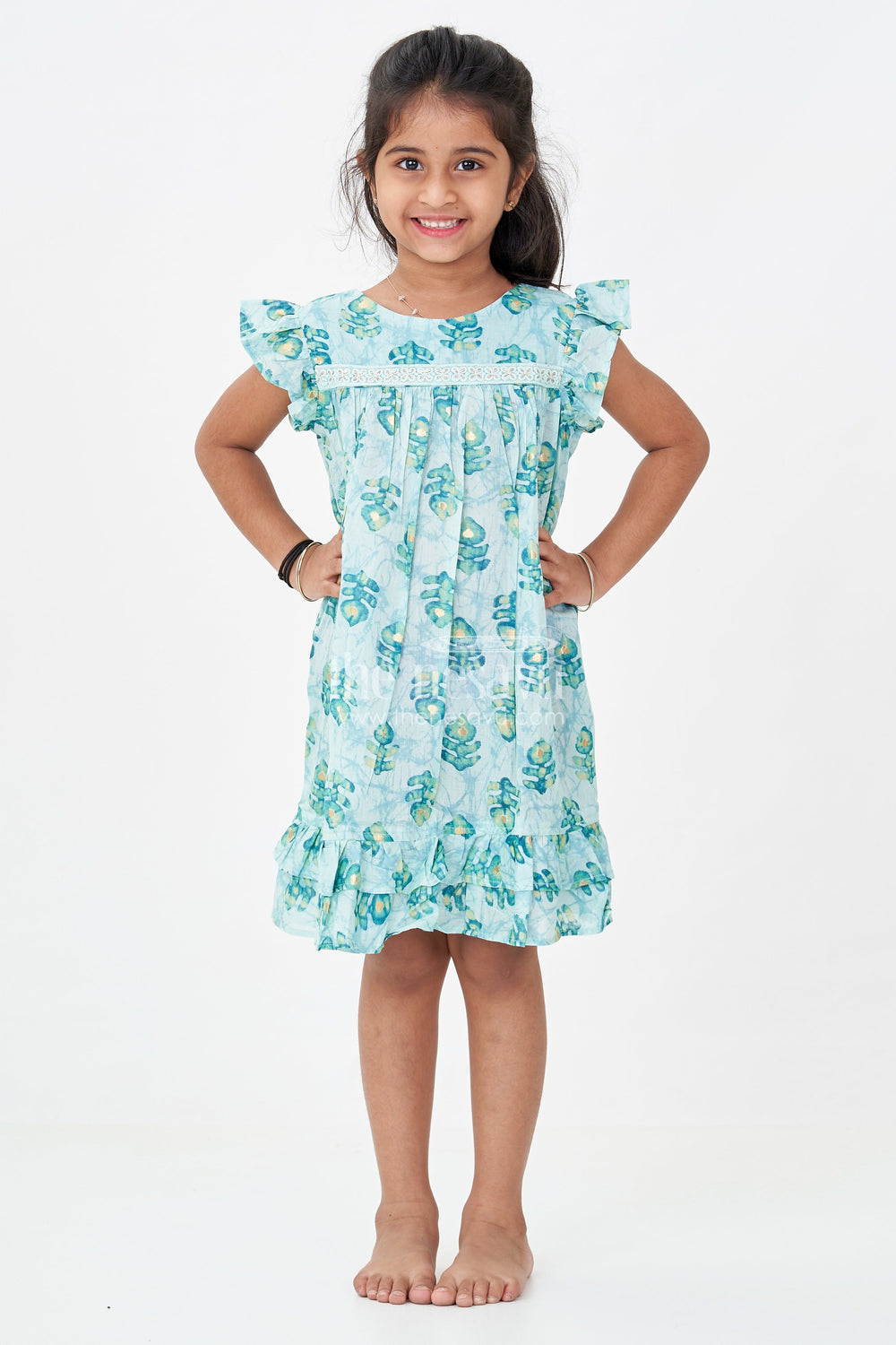 The Nesavu Girls Fancy Frock Girls Sky Blue Frock Design in Rayon with Leaf Motifs and Ruffle Accents for Whimsical Wear Nesavu Nesavu Girls Sky Blue Frock Design Rayon Green Leaf Digital Print Ruffle Hem