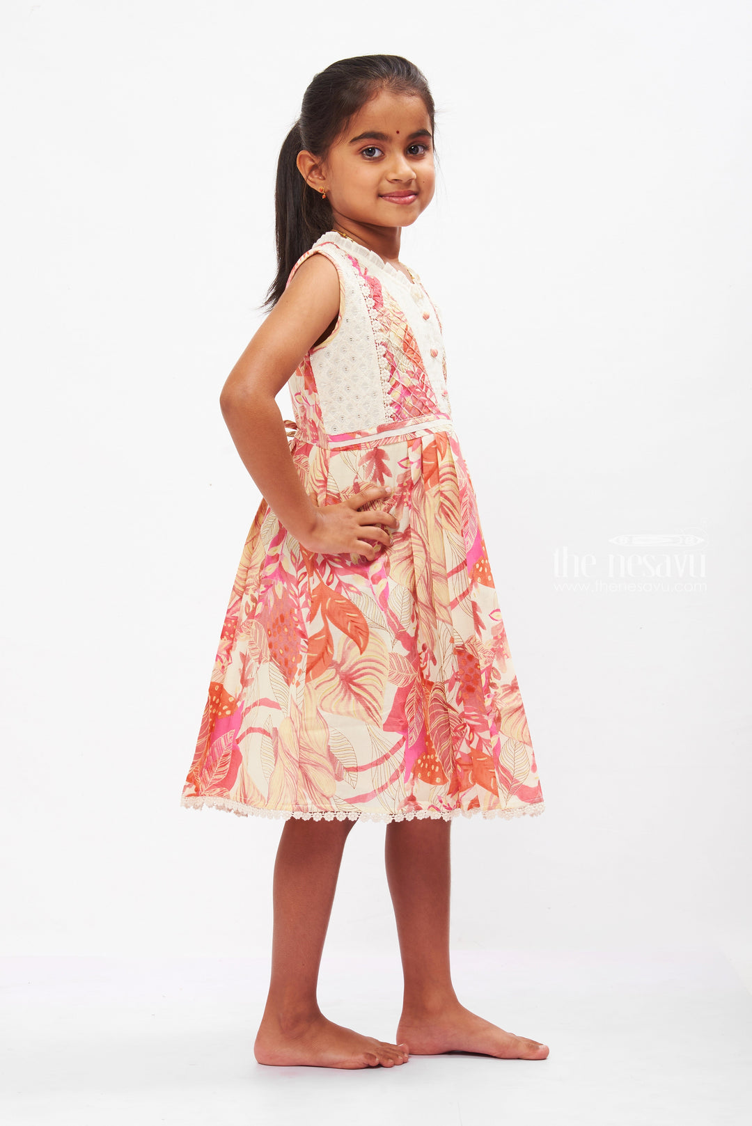 The Nesavu Girls Cotton Frock Girls Tropical Paradise Cotton Frock with Delicate Lace Accents Nesavu Exotic Leaf Print Cotton Frock for Girls | Summer Floral Elegance | The Nesavu