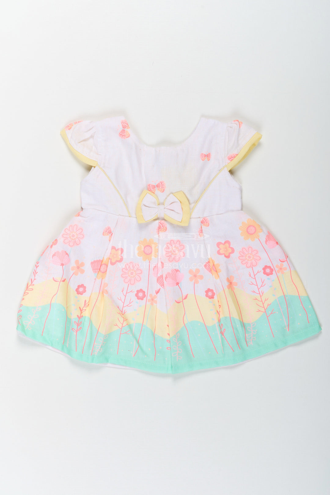 The Nesavu Baby Cotton Frocks Girls Ugadi Special Frock Dress in Soft Cotton with Pastel Floral Print and Yellow Bow Detail Nesavu 14 (6M) / Yellow BFJ756A-14 Nesavu Girls Cotton Ugadi Special Frock Dress Floral Print Yellow Waist Bow Festive Comfort