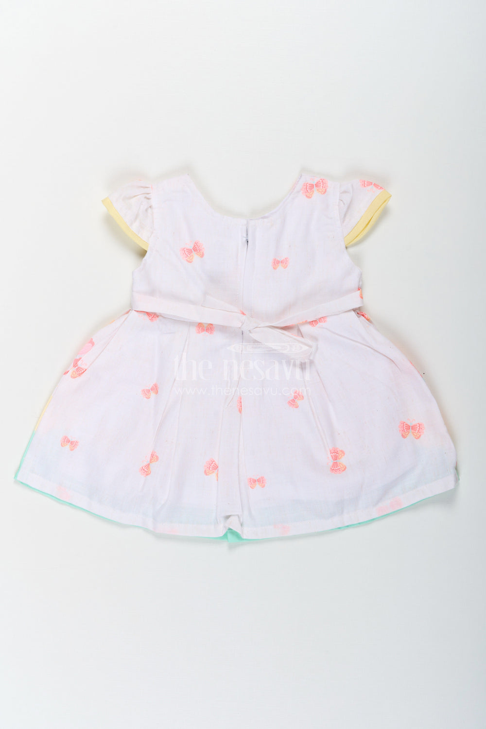 The Nesavu Baby Cotton Frocks Girls Ugadi Special Frock Dress in Soft Cotton with Pastel Floral Print and Yellow Bow Detail Nesavu Nesavu Girls Cotton Ugadi Special Frock Dress Floral Print Yellow Waist Bow Festive Comfort