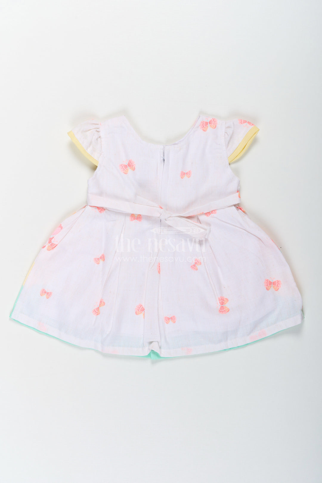The Nesavu Baby Cotton Frocks Girls Ugadi Special Frock Dress in Soft Cotton with Pastel Floral Print and Yellow Bow Detail Nesavu Nesavu Girls Cotton Ugadi Special Frock Dress Floral Print Yellow Waist Bow Festive Comfort