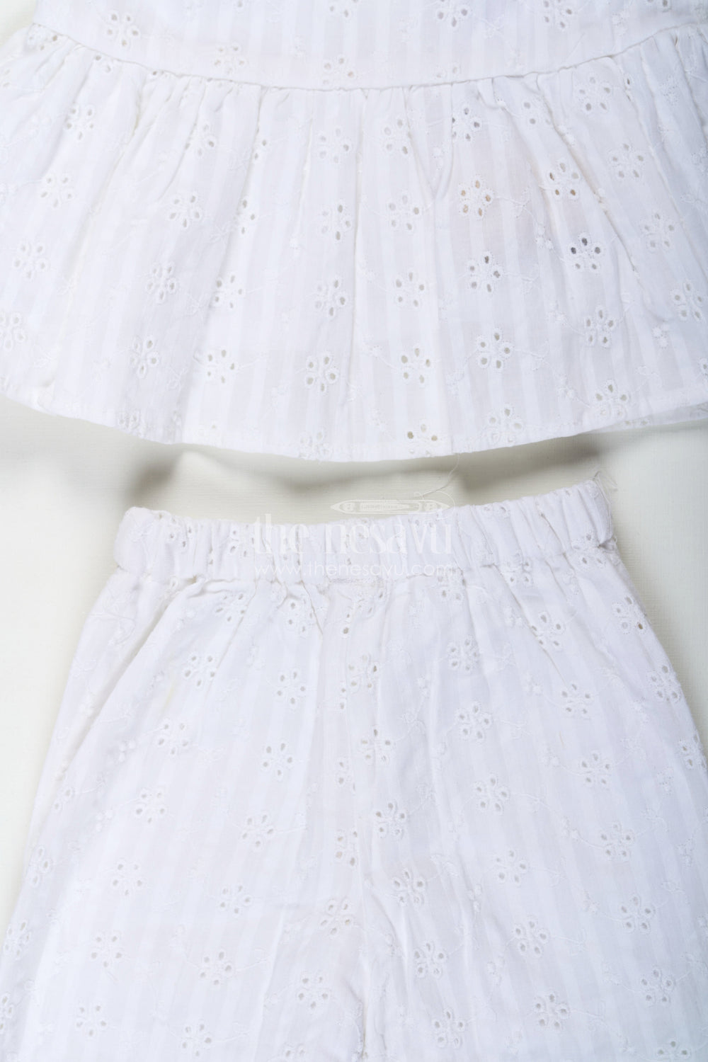 The Nesavu Girls Casual Set Girls White Party Wear Set in Hakoba Cotton with Bow-Tie Straps and Elegant Embroidery Nesavu Nesavu Girls White Party Wear Set in Hakoba Cotton with Embroidered Design and Bow-Tie Top